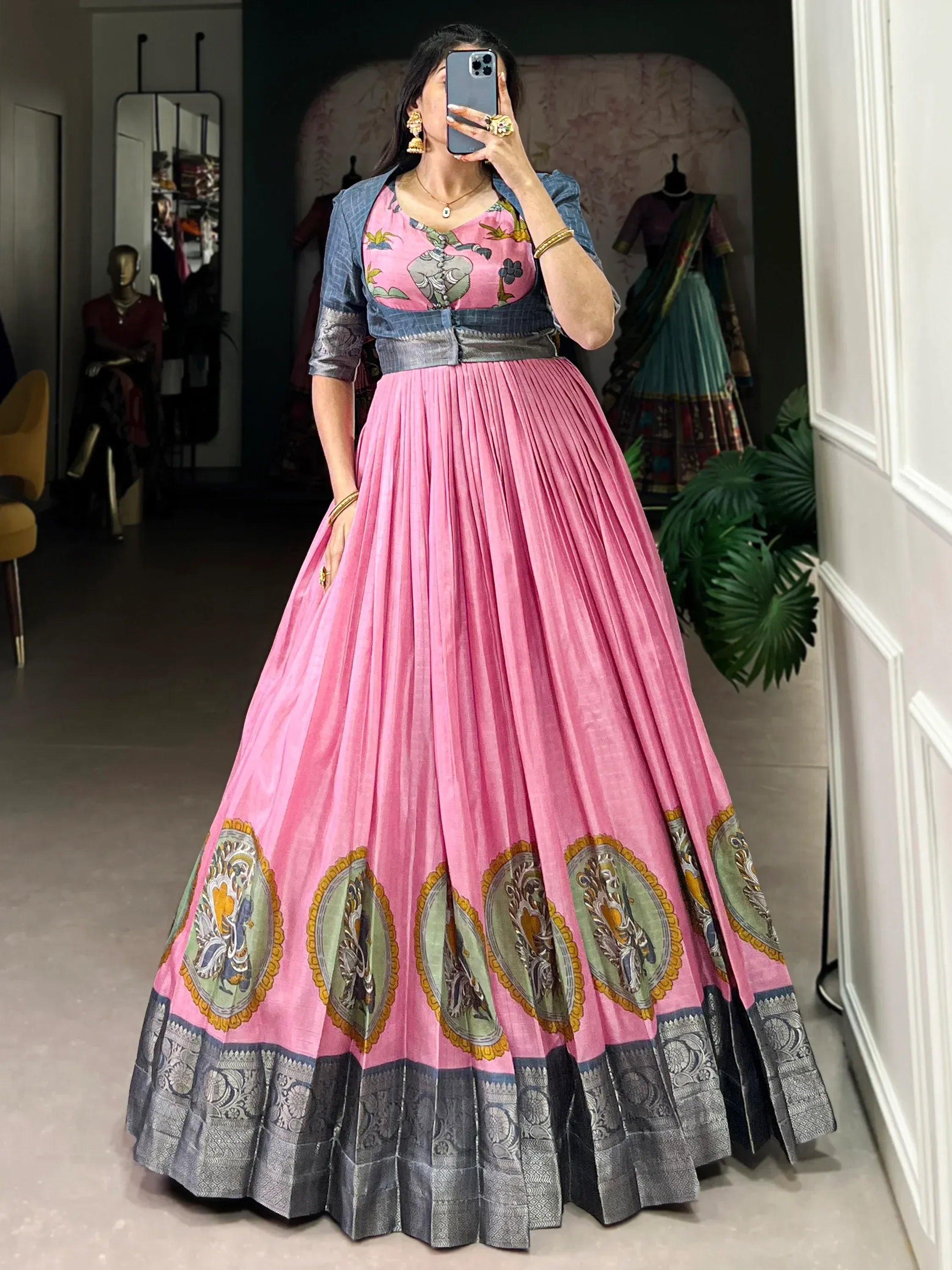 Pink pleated lehenga with floral blouse and embroidered border, perfect for Indian ethnic wear