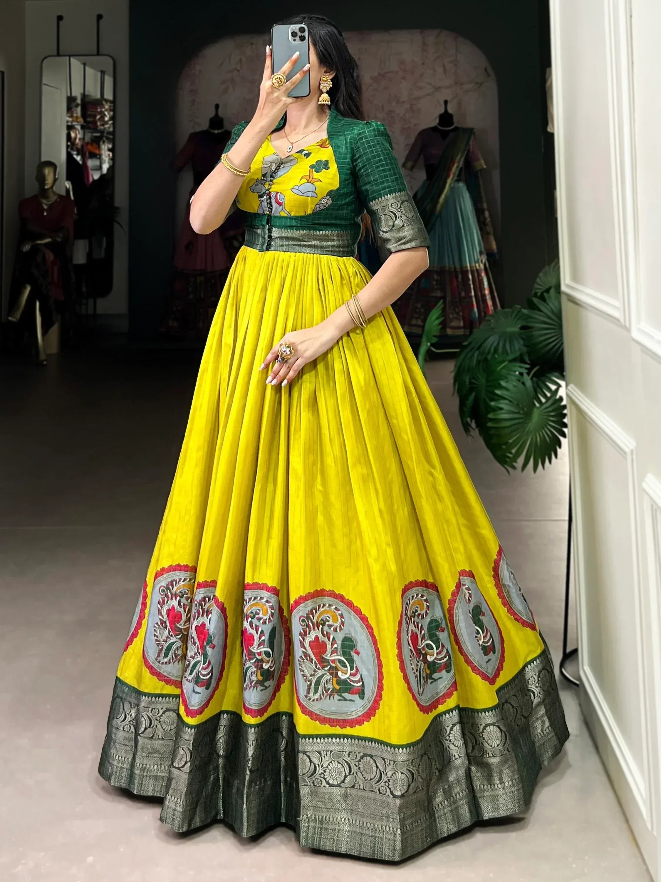 Vibrant yellow lehenga with green blouse and embroidered motifs, perfect for Indian ethnic wear.