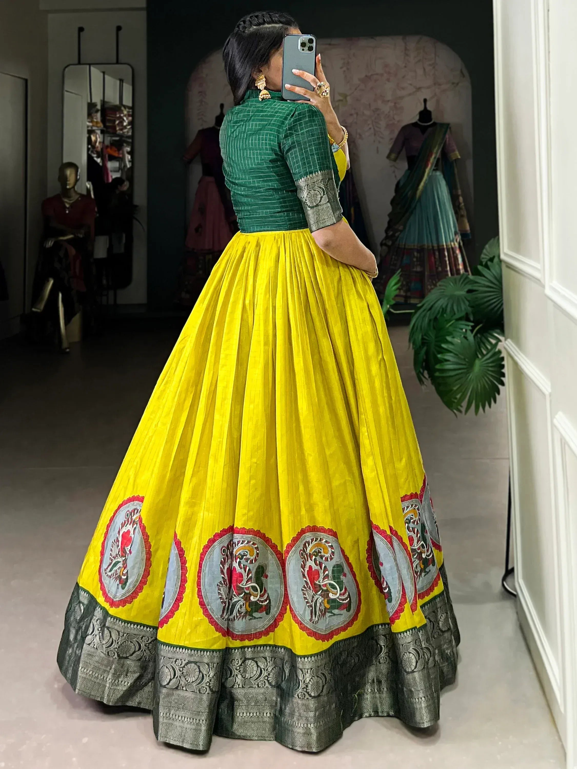 Vibrant yellow lehenga with green blouse and embroidered motifs, perfect for Indian ethnic wear.