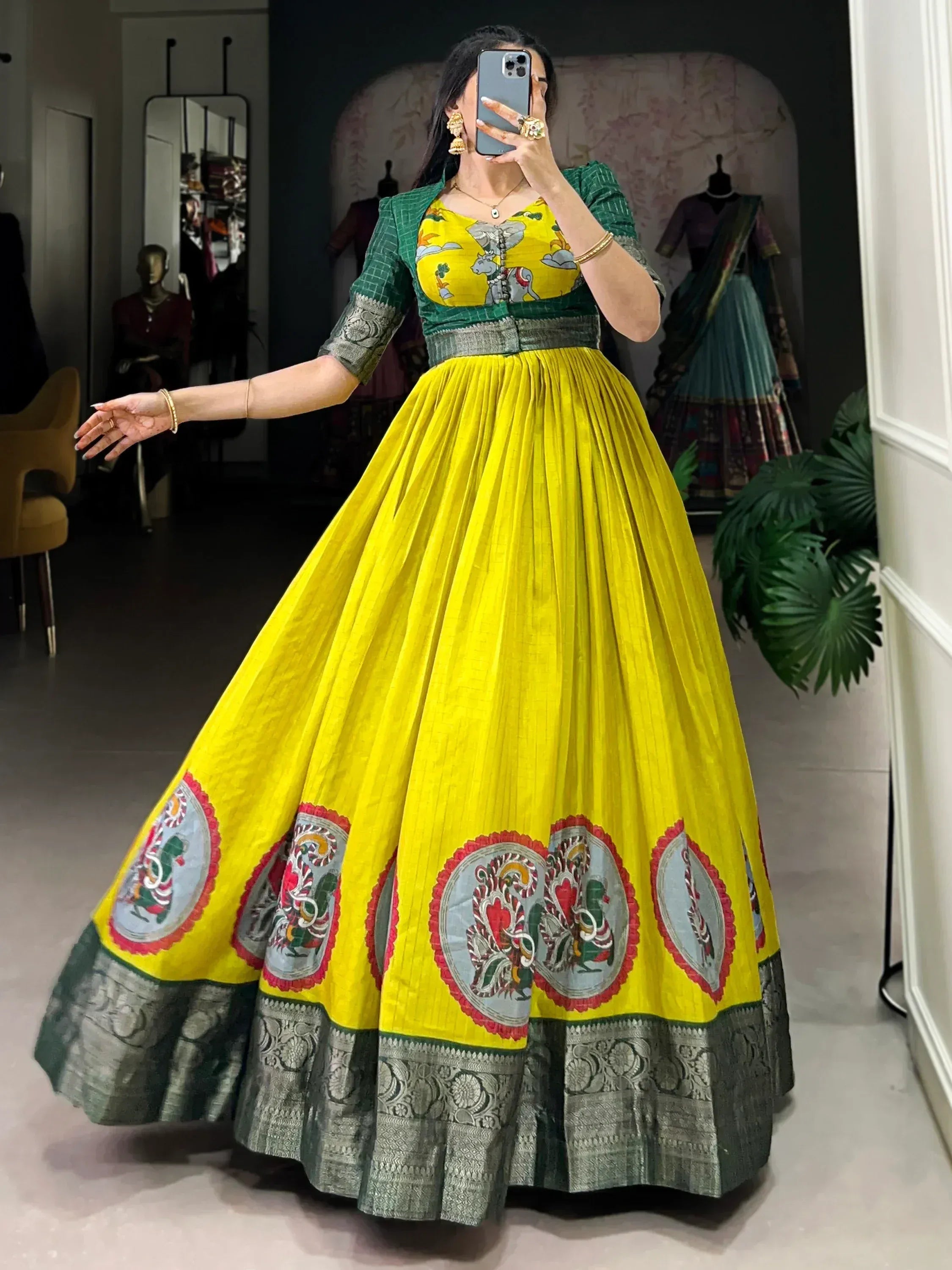 Vibrant yellow lehenga with green blouse and embroidered motifs, perfect for Indian ethnic wear.