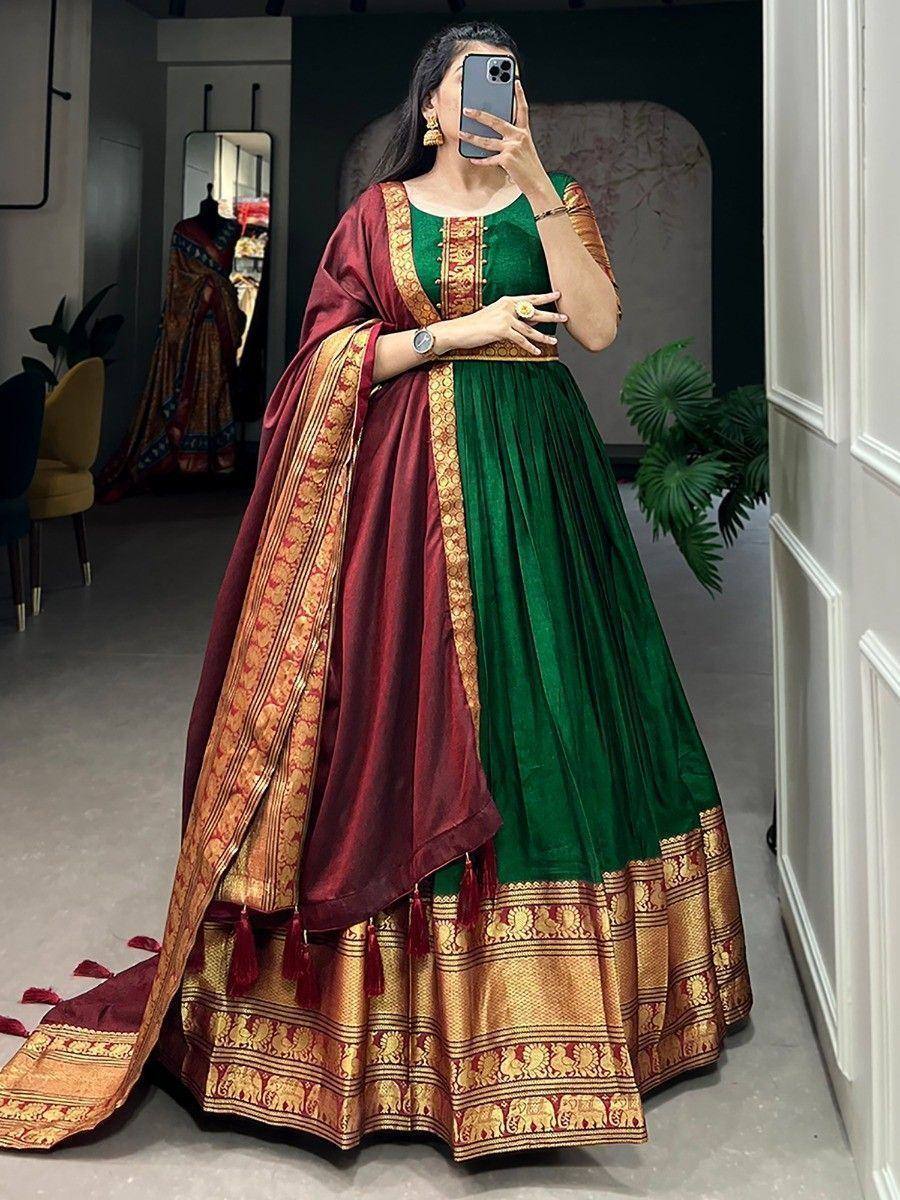 Green and maroon designer lehenga choli with gold elephant border, perfect for Indian ethnic wear occasions