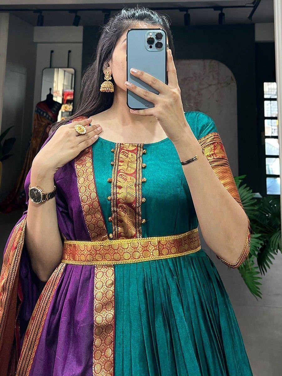 Teal and purple ethnic gown with gold embroidery, perfect for Indian festive occasions
