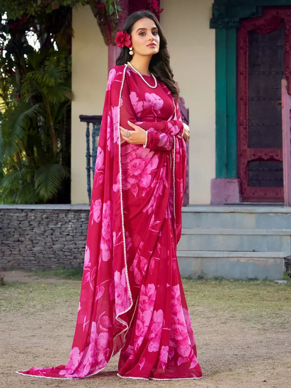 Elegant pink floral saree with pearl border, perfect for Indian ethnic occasions