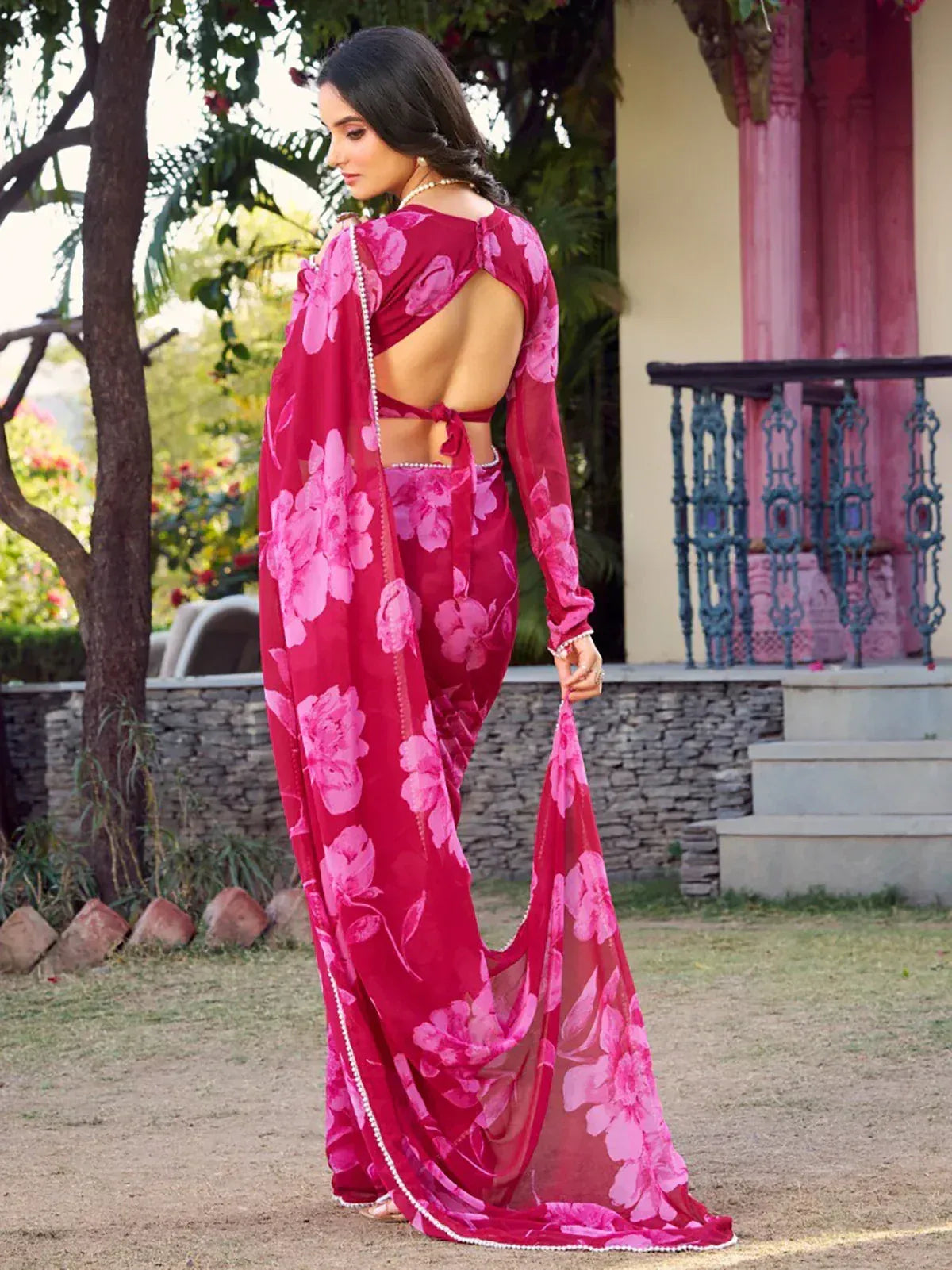 Pink floral saree with backless blouse, perfect for ethnic occasions