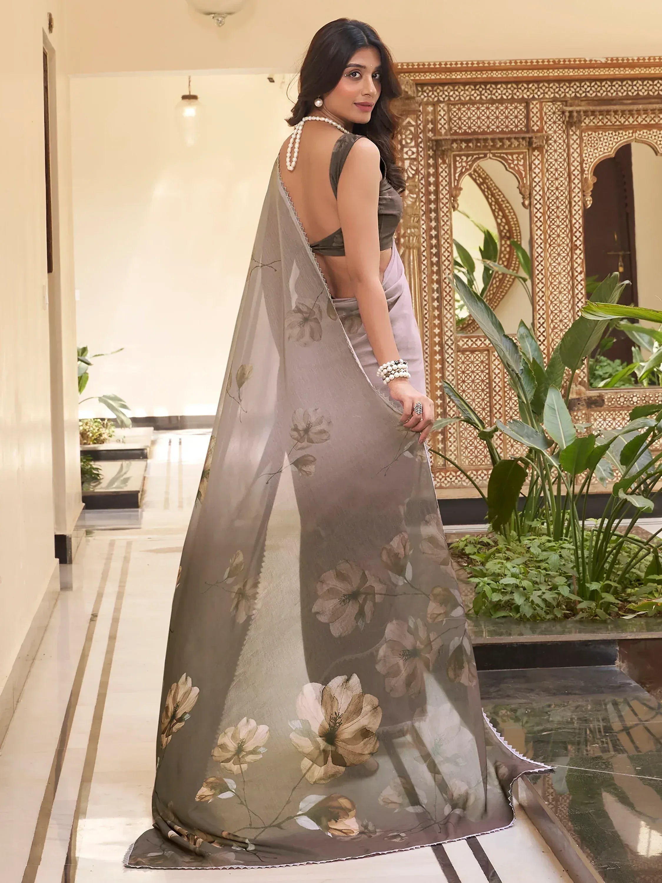 Woman in elegant floral print saree with backless blouse, Indian ethnic wear