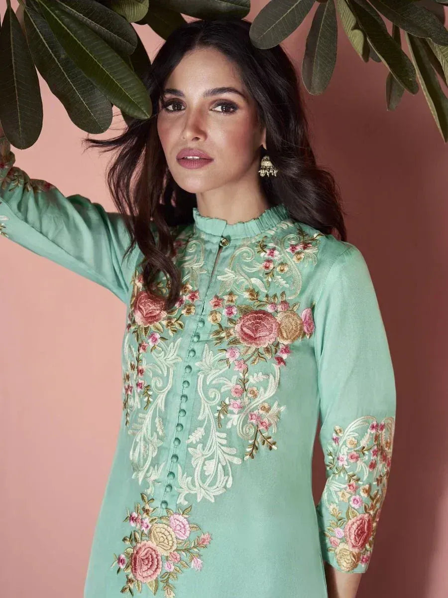 Mint green embroidered kurti with floral design, perfect for ethnic wear and festive occasions.