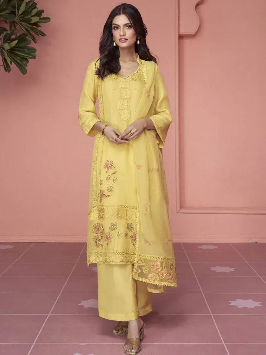 Yellow embroidered salwar kameez with floral design, perfect for ethnic wear and festive occasions.