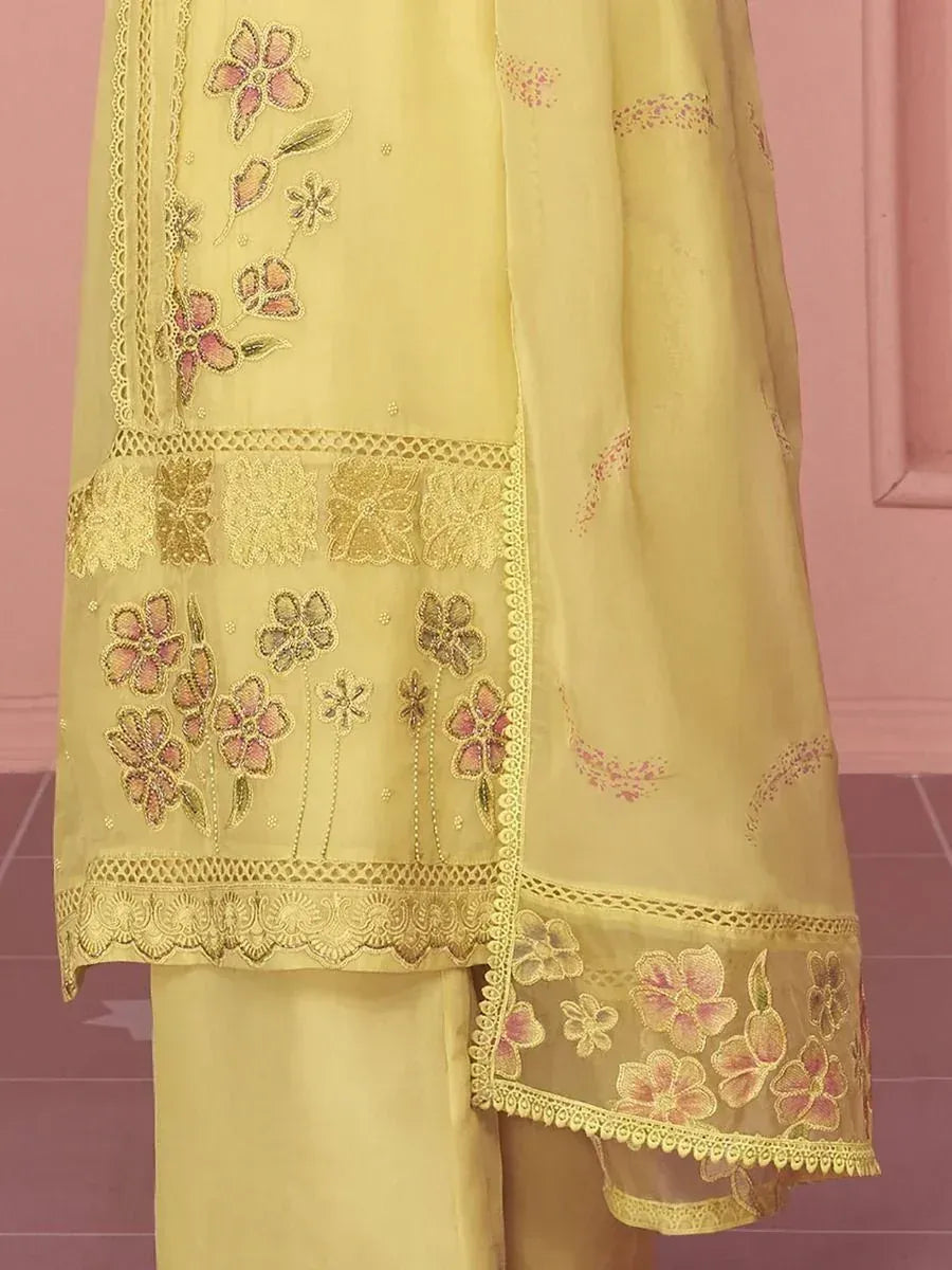 Yellow embroidered salwar kameez with floral lace detailing, perfect for ethnic occasions