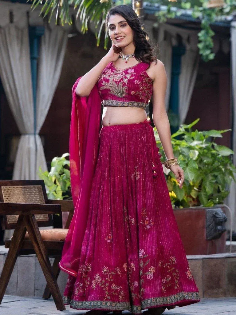Elegant magenta lehenga choli with floral embroidery, perfect for Indian ethnic occasions and weddings.
