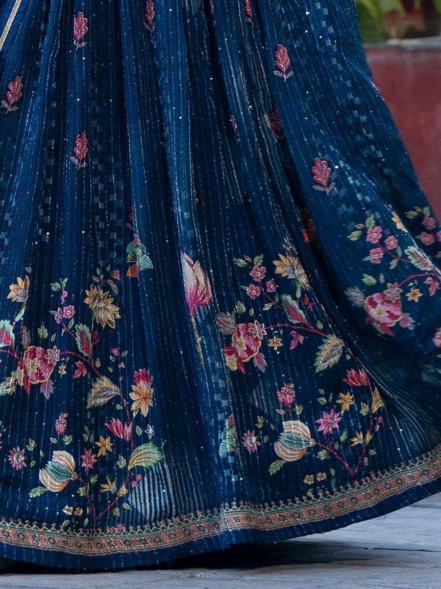 Navy blue lehenga with floral embroidery and pleated design, perfect for Indian ethnic wear occasions.
