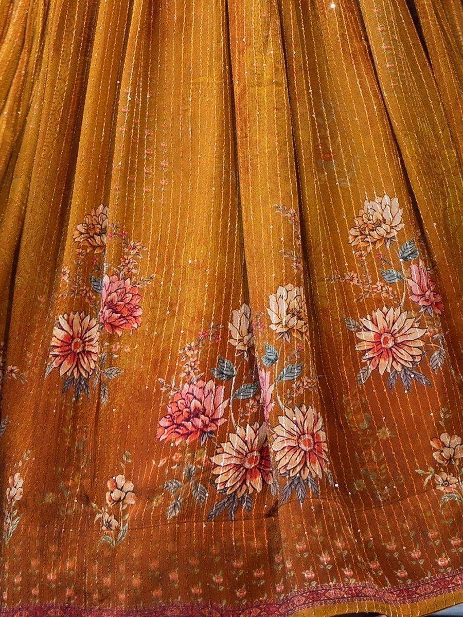 Mustard floral print lehenga skirt with delicate embroidery and pleats, ideal for ethnic wear occasions