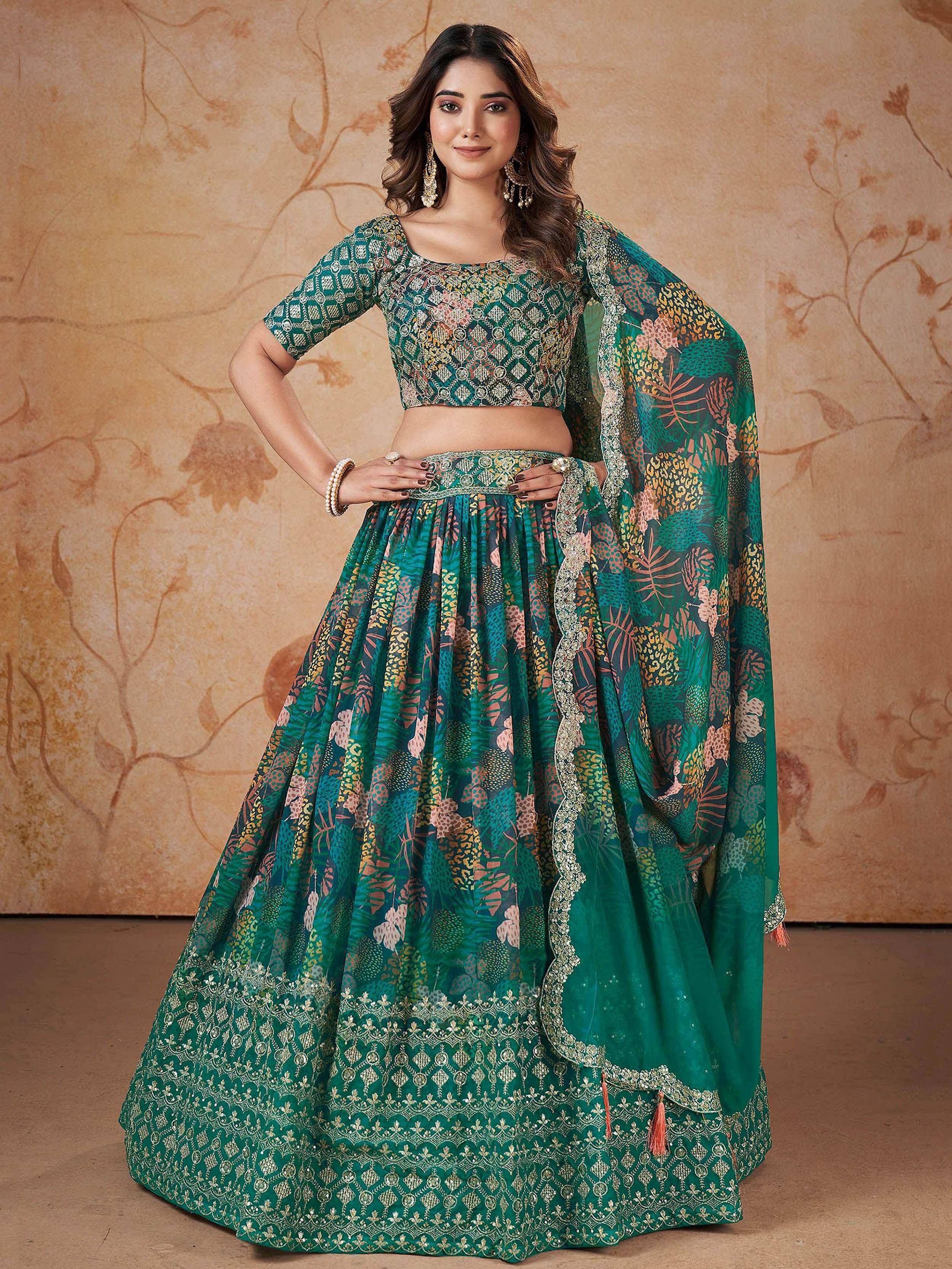 Emerald green printed lehenga choli with floral motifs and gold embroidery, perfect for Indian ethnic wear.