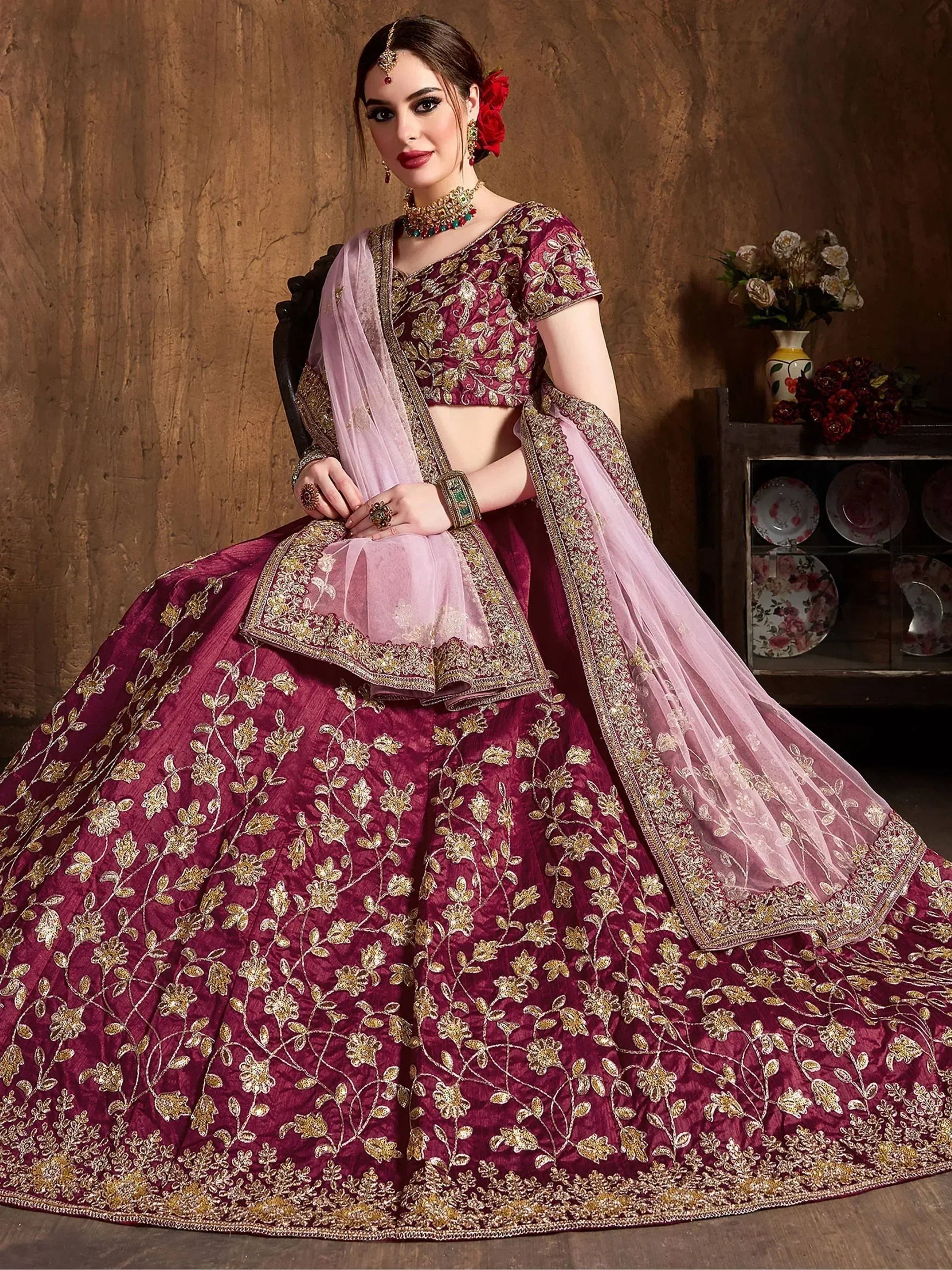 Maroon designer lehenga choli with gold floral embroidery and pink dupatta, ethnic Indian wear