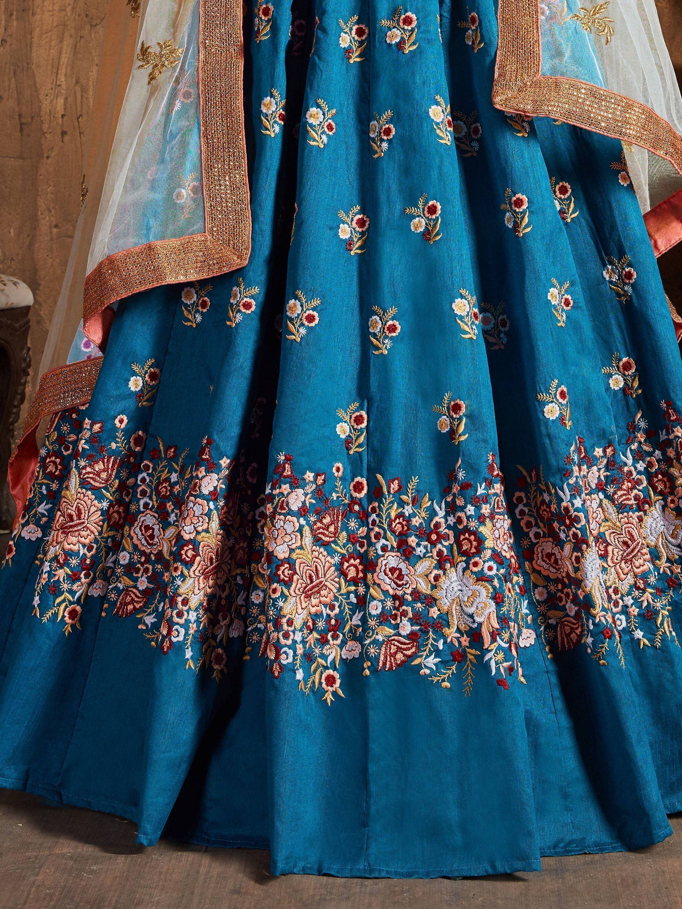 Teal blue lehenga with intricate floral embroidery and golden border, perfect for Indian ethnic wear