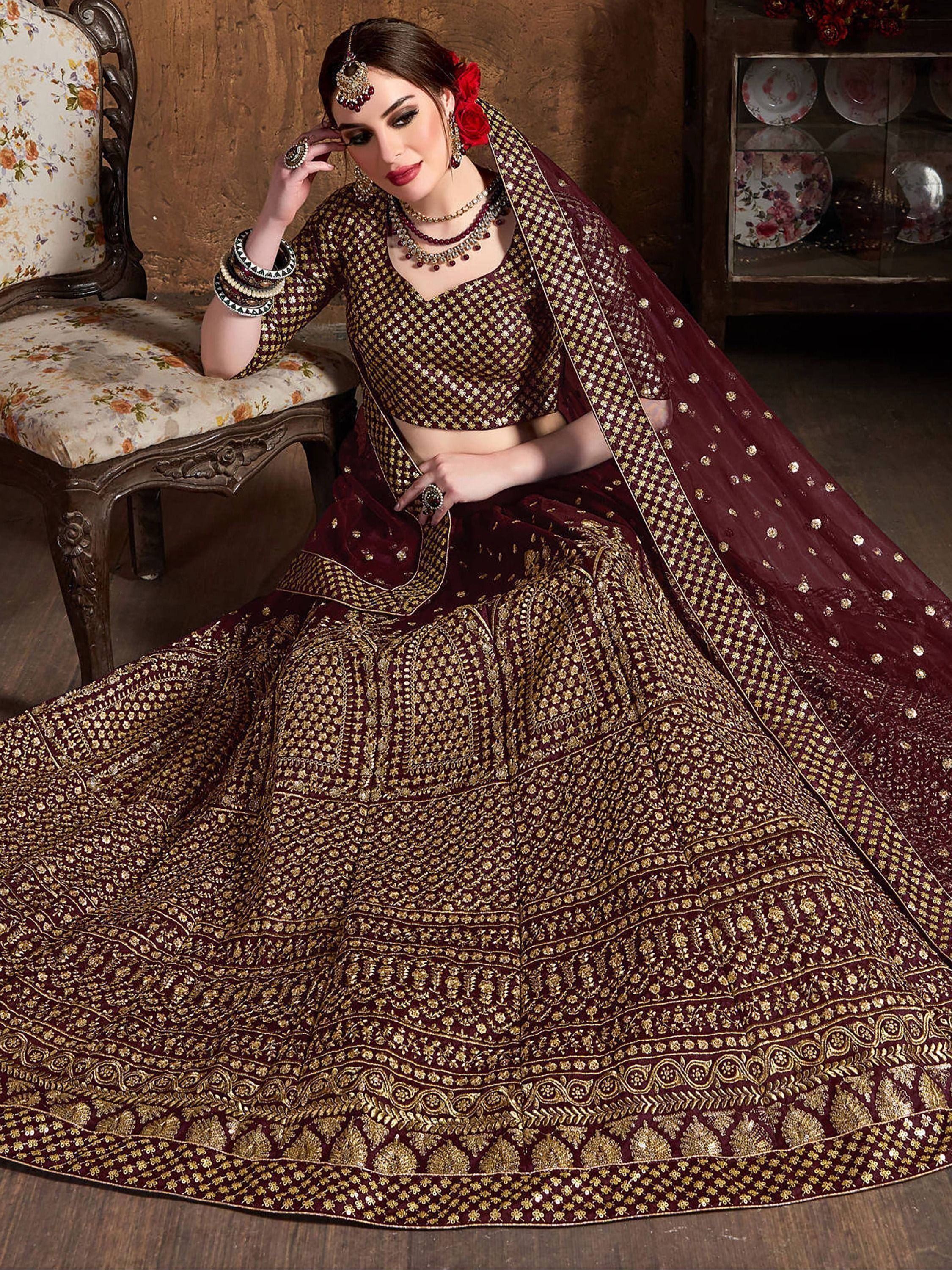 Maroon designer lehenga choli with gold embroidery, perfect for Indian weddings and festive occasions