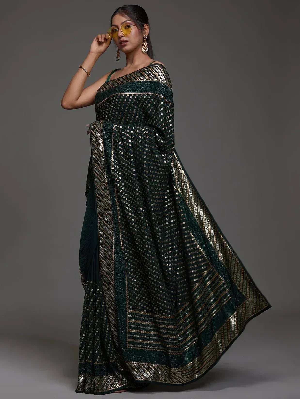 Emerald green sequin saree with gold border, perfect for Indian ethnic wear occasions
