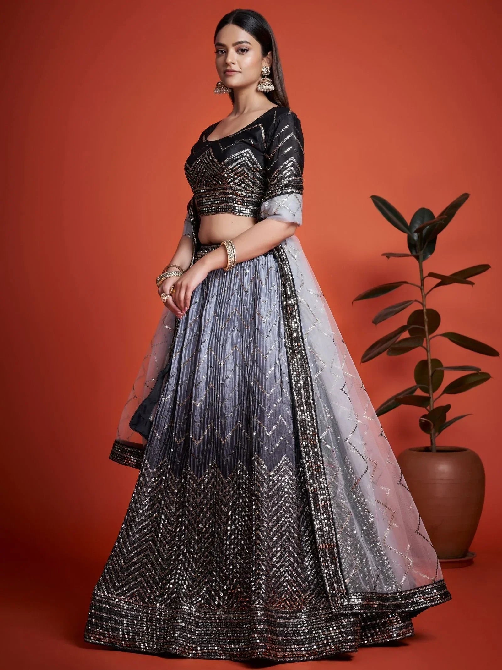 Black and silver sequin lehenga choli with chevron pattern, perfect for Indian ethnic wear events