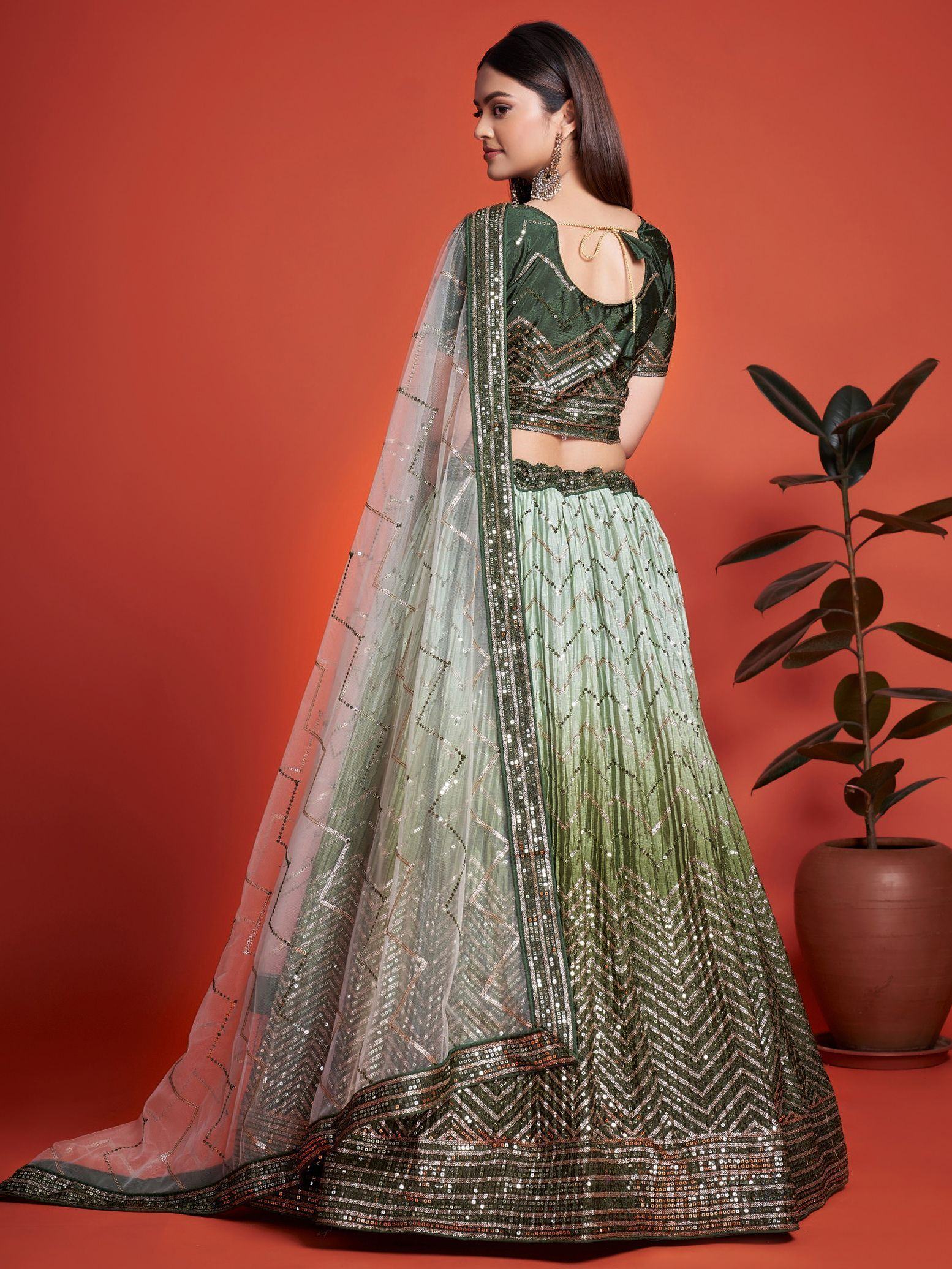 Green sequin lehenga choli with sheer dupatta, ethnic Indian wear for weddings and parties