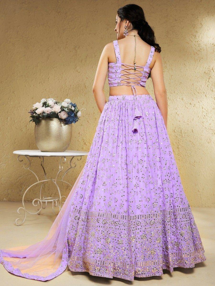 Lavender designer lehenga choli with back tie-up and floral embroidery, perfect for Indian ethnic occasions.