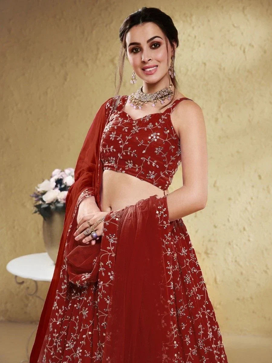 Red embroidered lehenga choli with floral detailing, perfect for Indian ethnic wear occasions