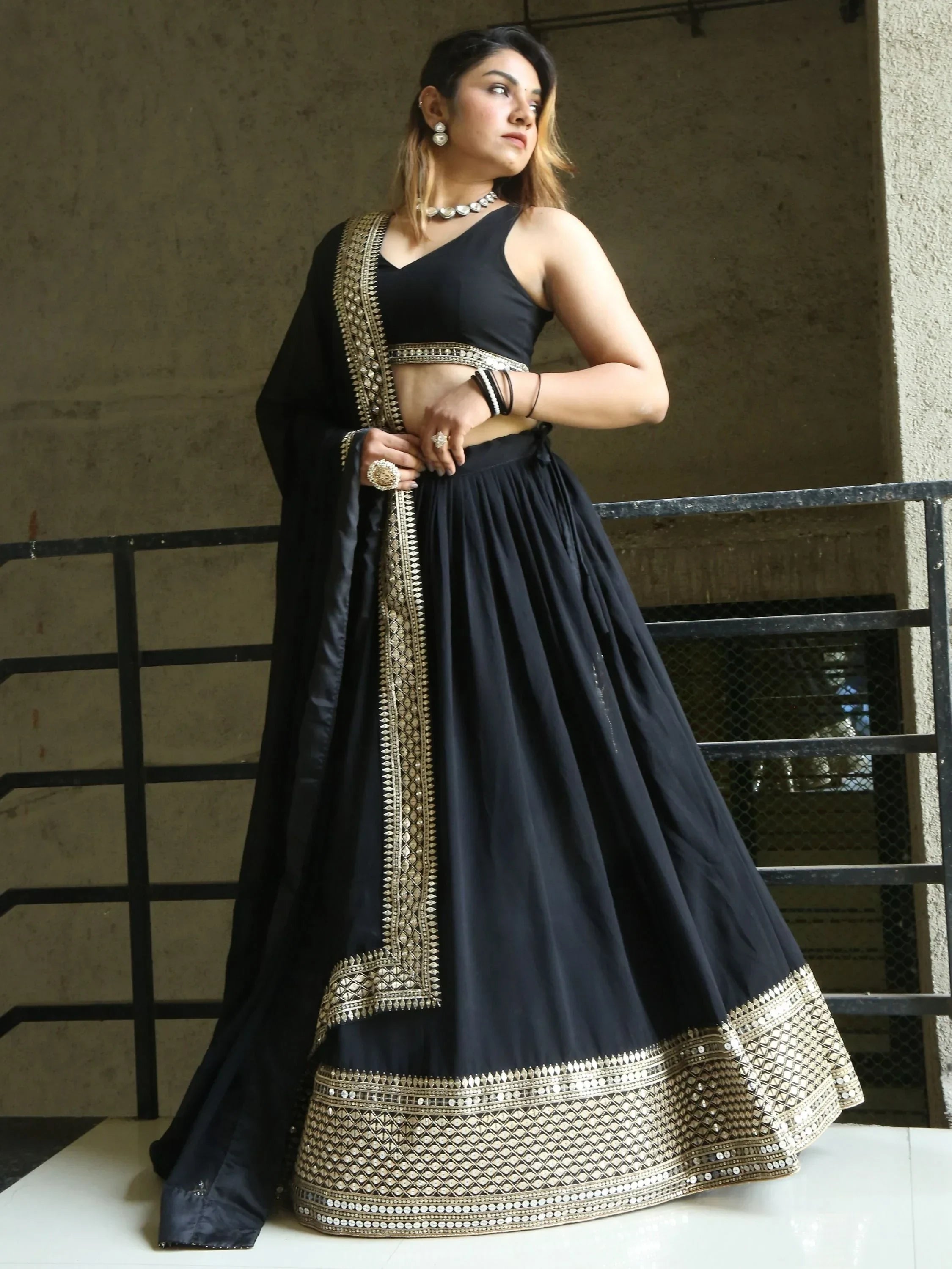 Black lehenga choli with gold mirror work, perfect for Indian ethnic wear and festive occasions