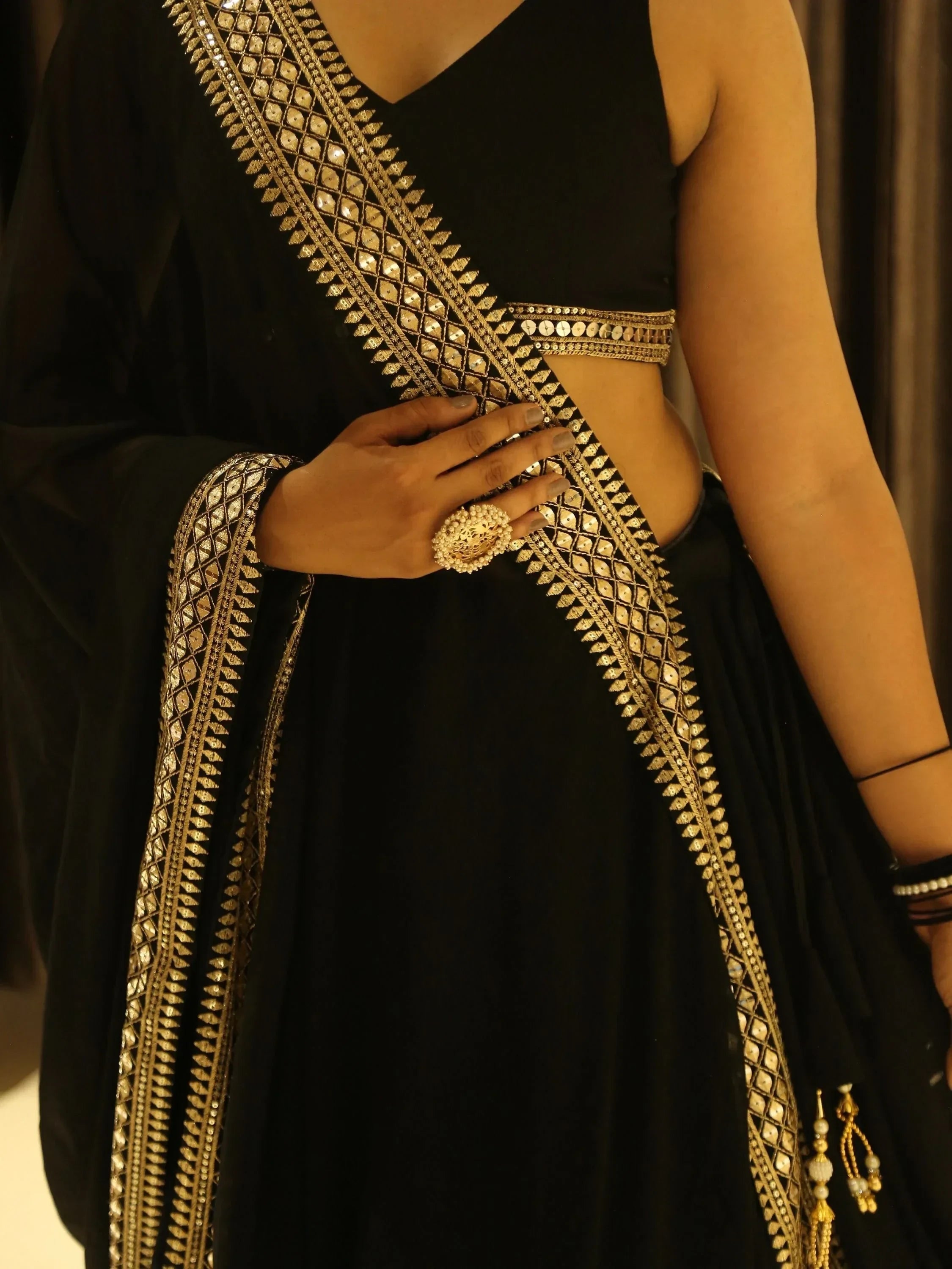 Black ethnic gown with gold mirror work and embroidery, perfect for Indian occasions