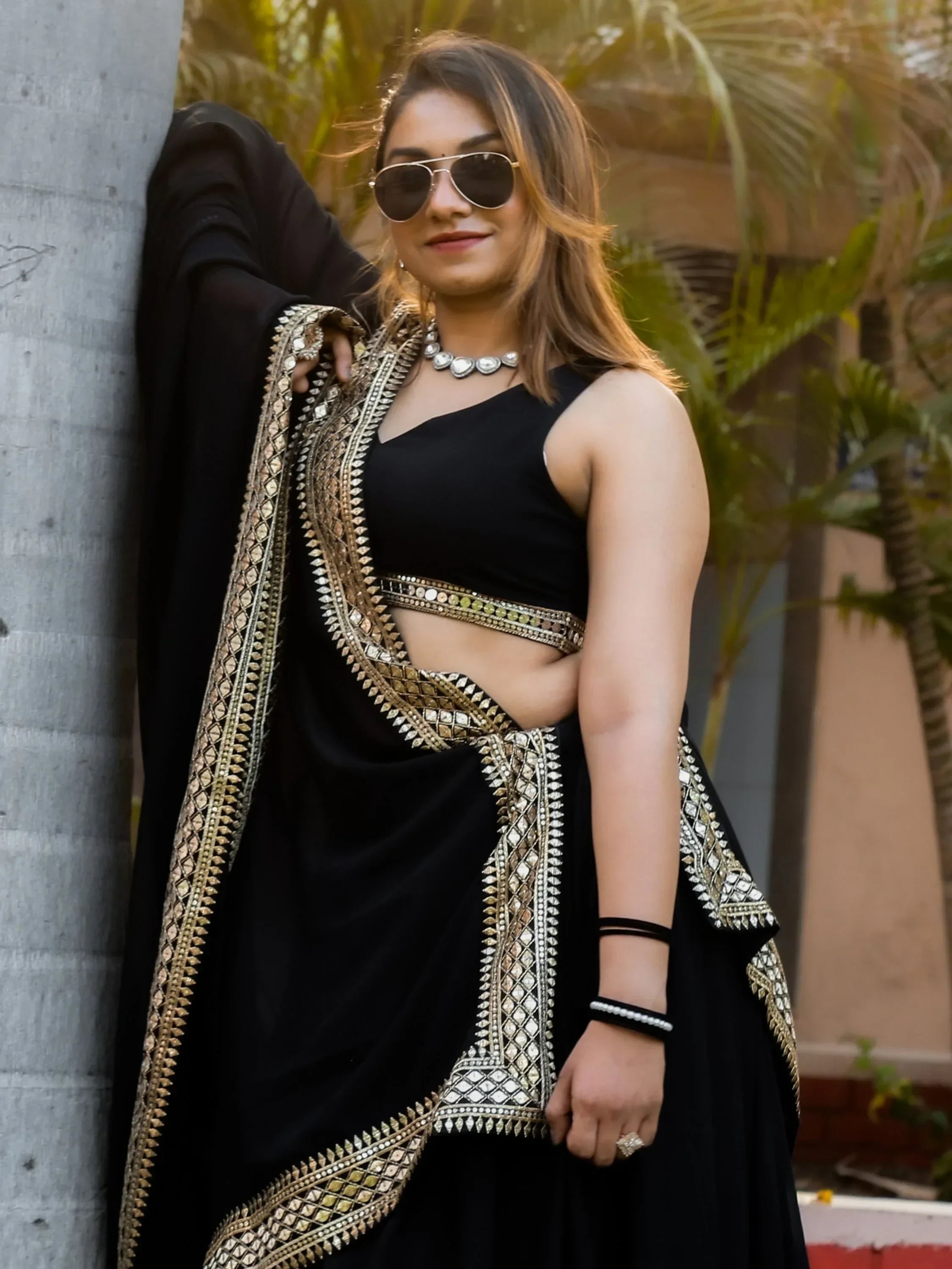 Black designer lehenga choli with gold mirror work, perfect for Indian ethnic wear events