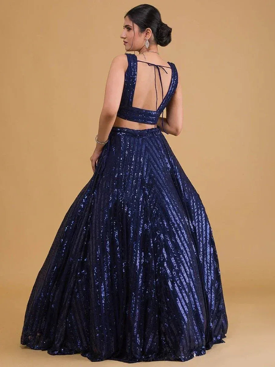 Navy blue sequin lehenga choli with open back, perfect for Indian ethnic wear events