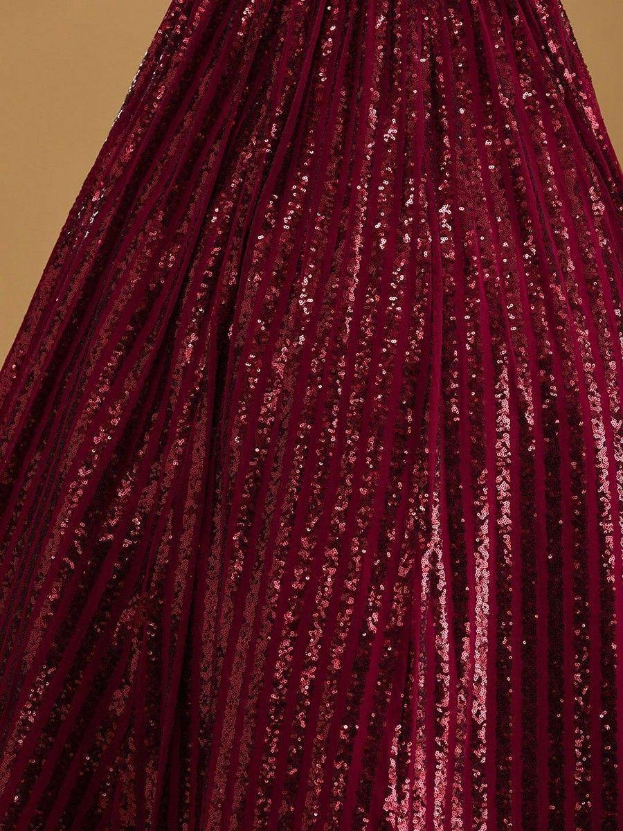 Sparkling maroon pleated lehenga skirt with sequin embellishments, perfect for Indian ethnic wear occasions.