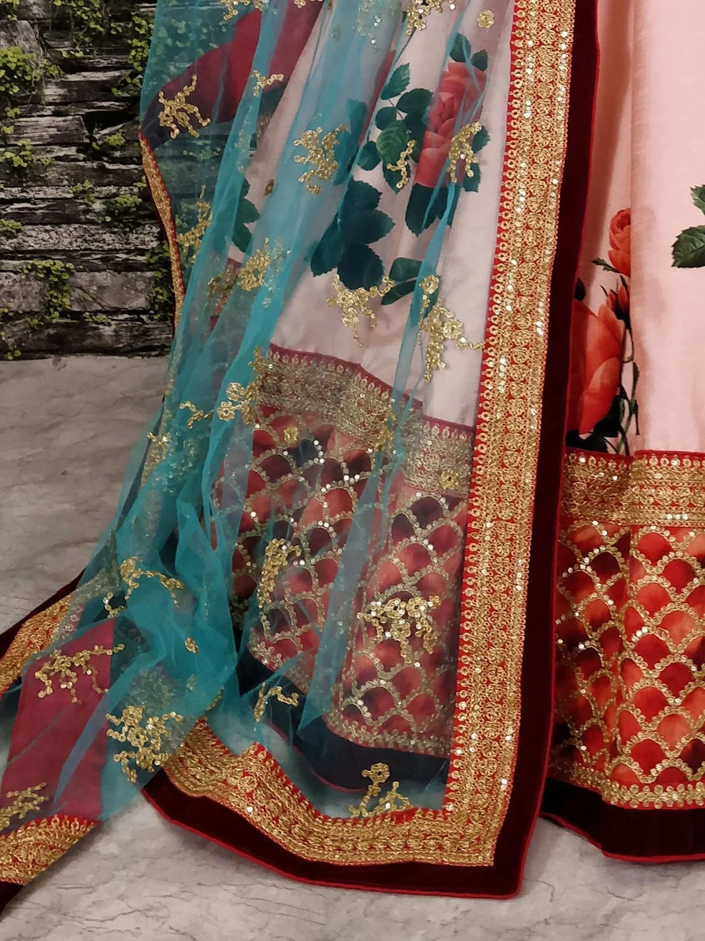 Designer lehenga choli with floral print, gold embroidery, and sheer dupatta for Indian ethnic wear