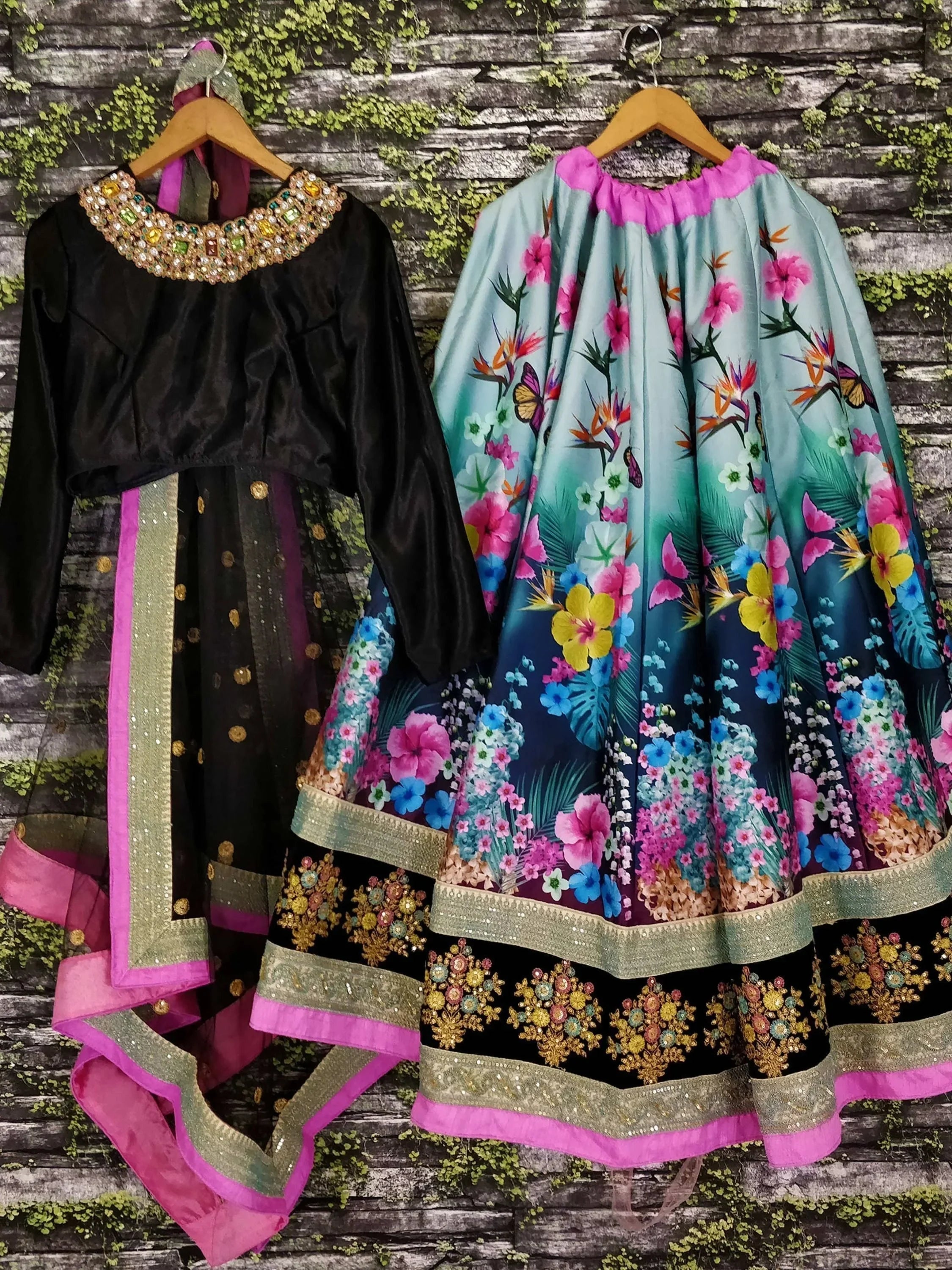 Black velvet and floral print lehenga choli with embroidered borders and embellished neckline, perfect for ethnic occasions.