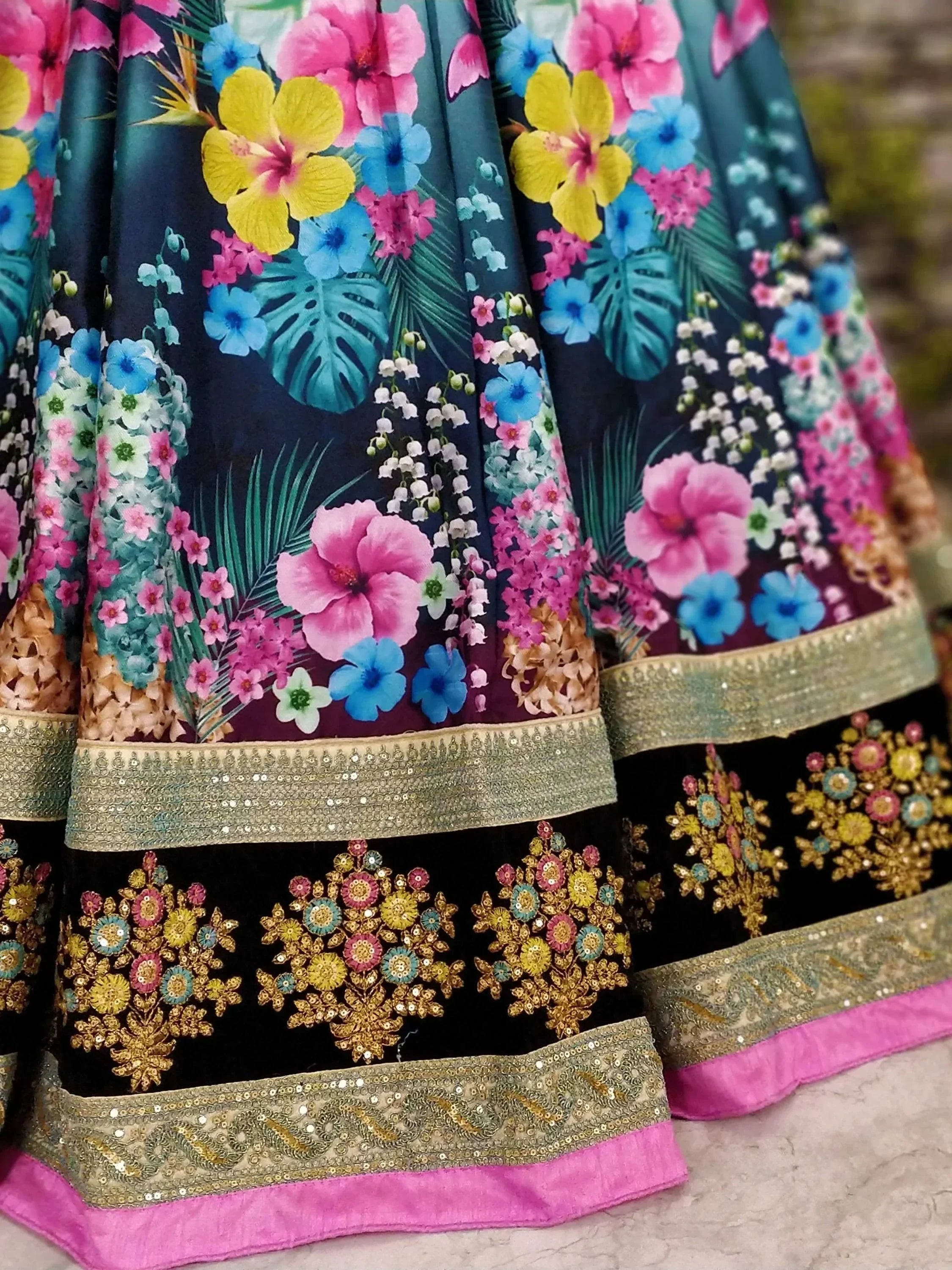 Vibrant floral print lehenga with sequin embroidery and pink border, ideal for Indian ethnic wear