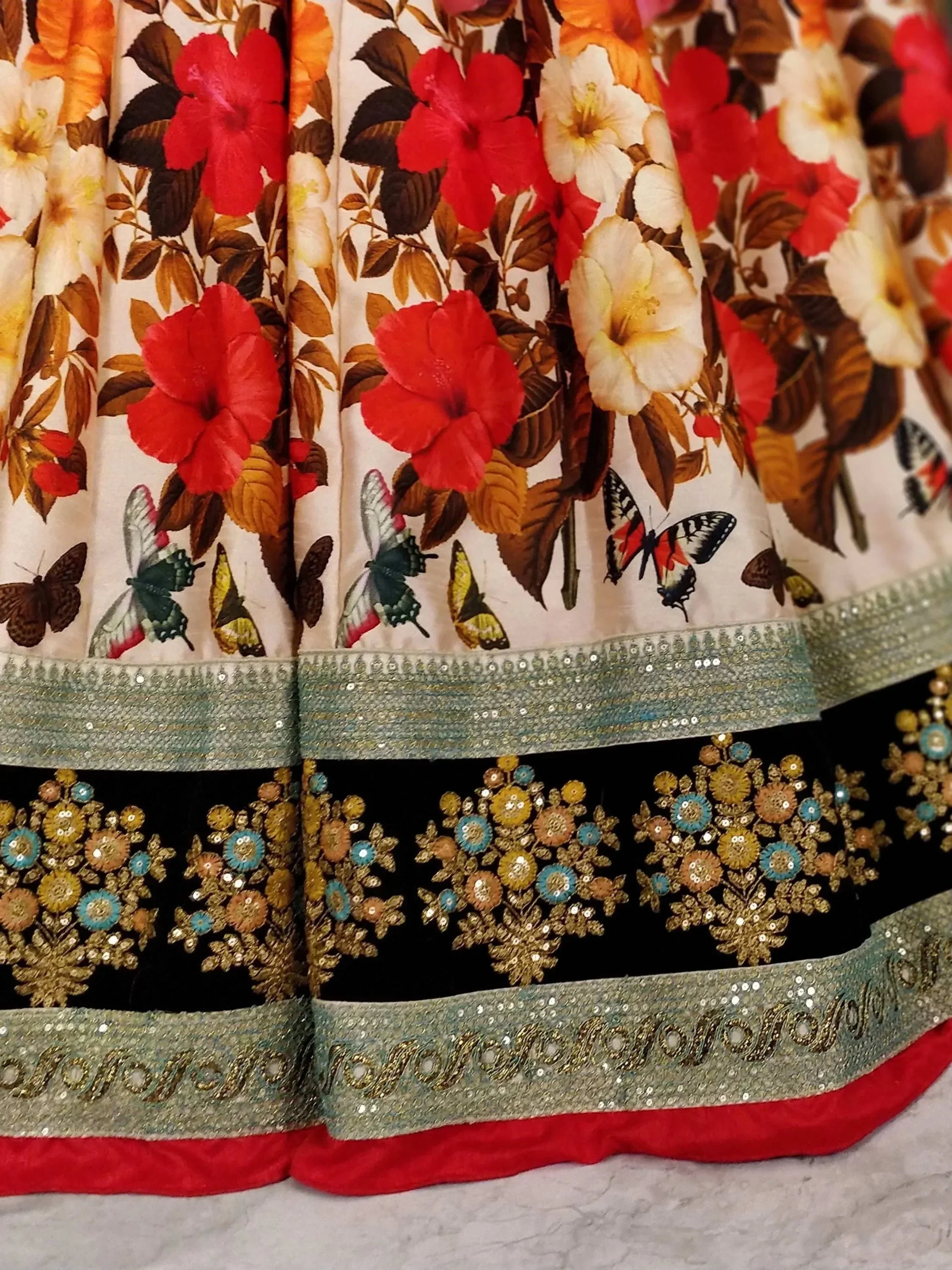 Floral butterfly print lehenga with sequin border and embroidered black panel