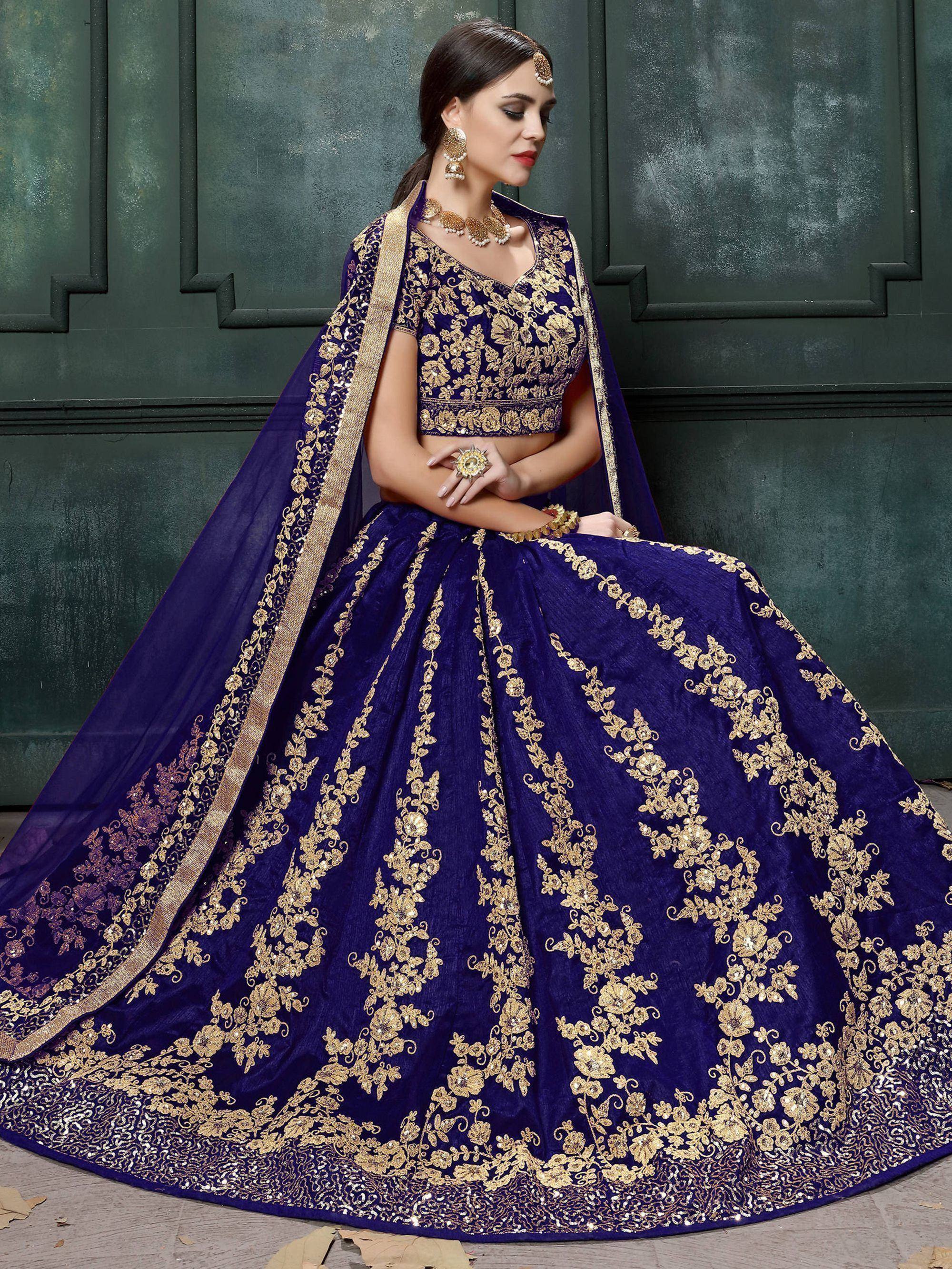 Royal blue designer lehenga choli with gold floral embroidery, perfect for weddings and festive occasions.