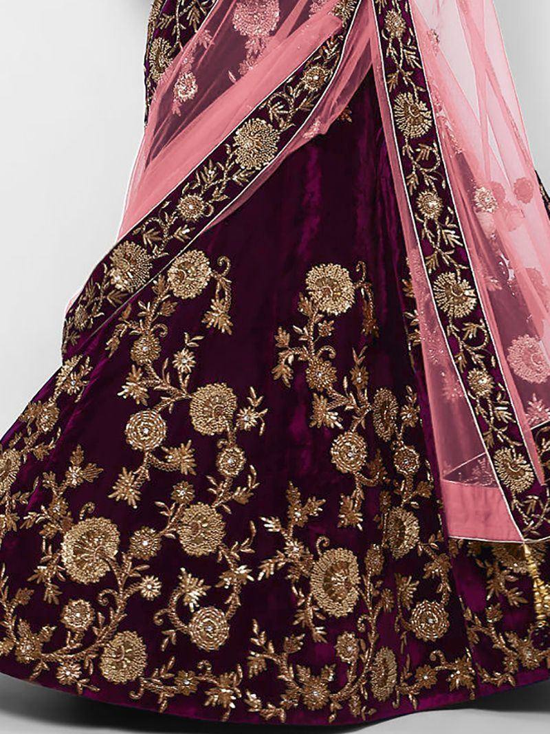 Luxury maroon velvet lehenga with gold floral embroidery and pink dupatta, perfect for Indian weddings