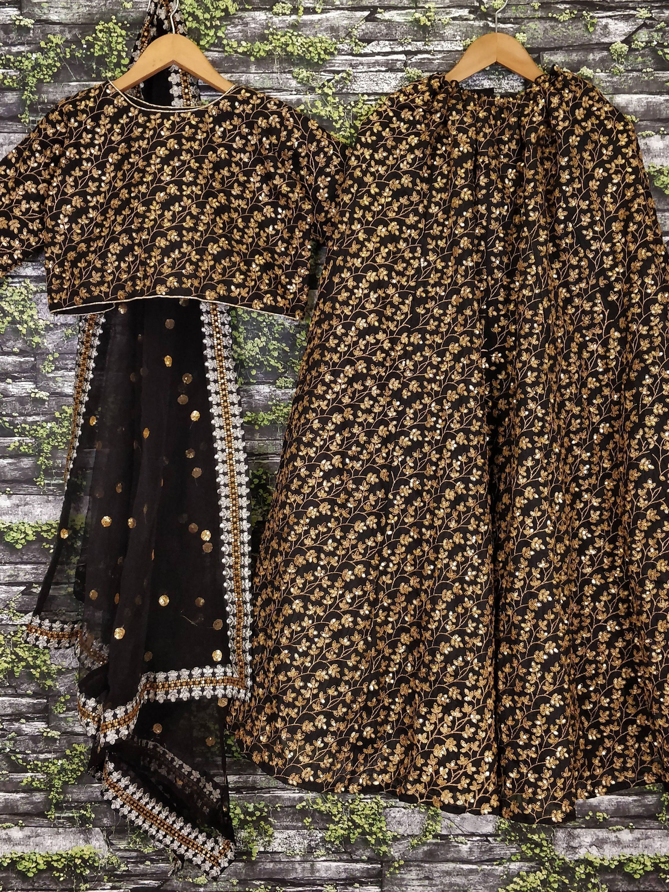 Black and gold embroidered ethnic salwar kameez with floral sequin work, perfect for festive occasions.
