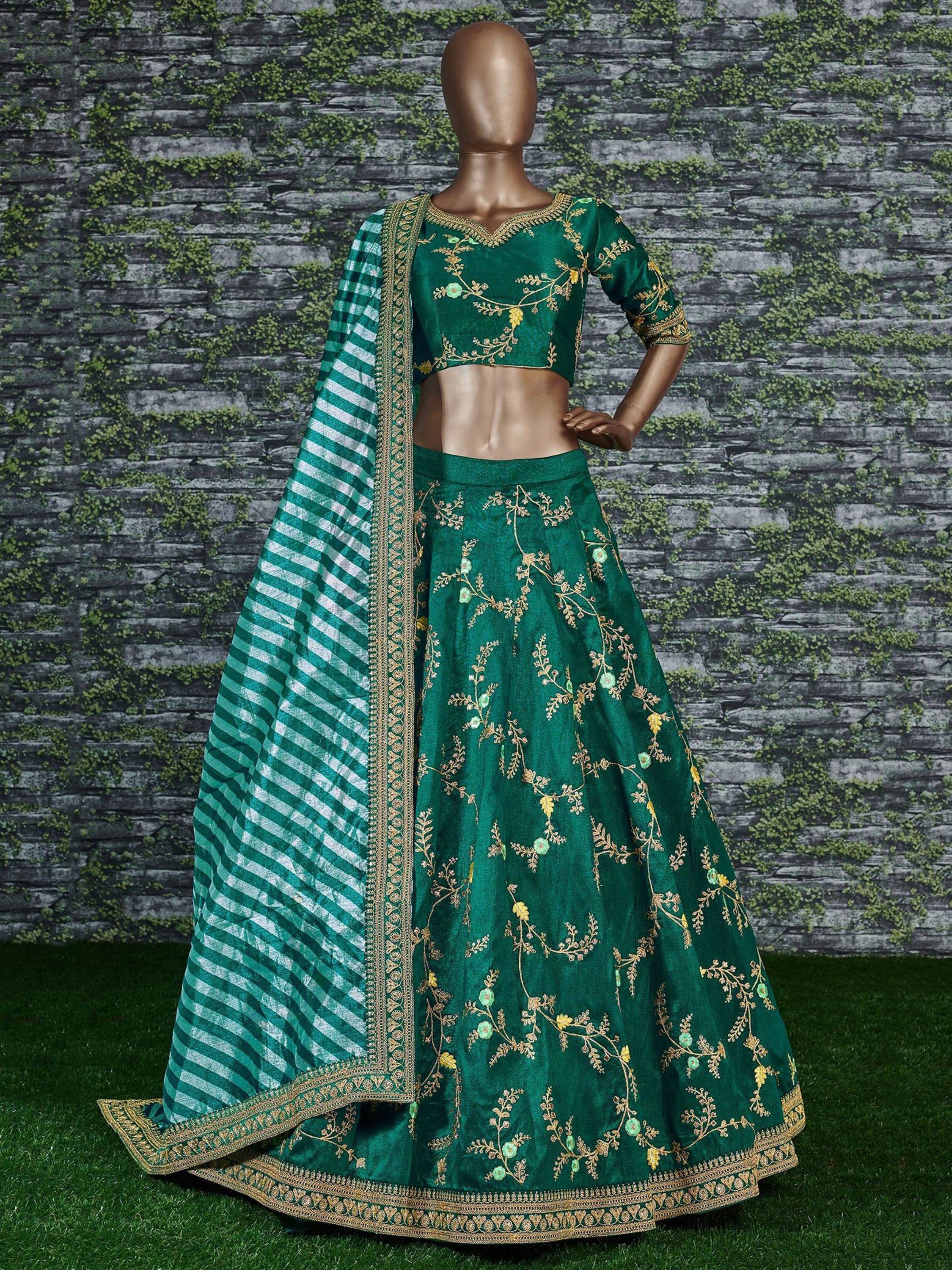 Emerald green lehenga choli with gold floral embroidery and striped dupatta, displayed on mannequin