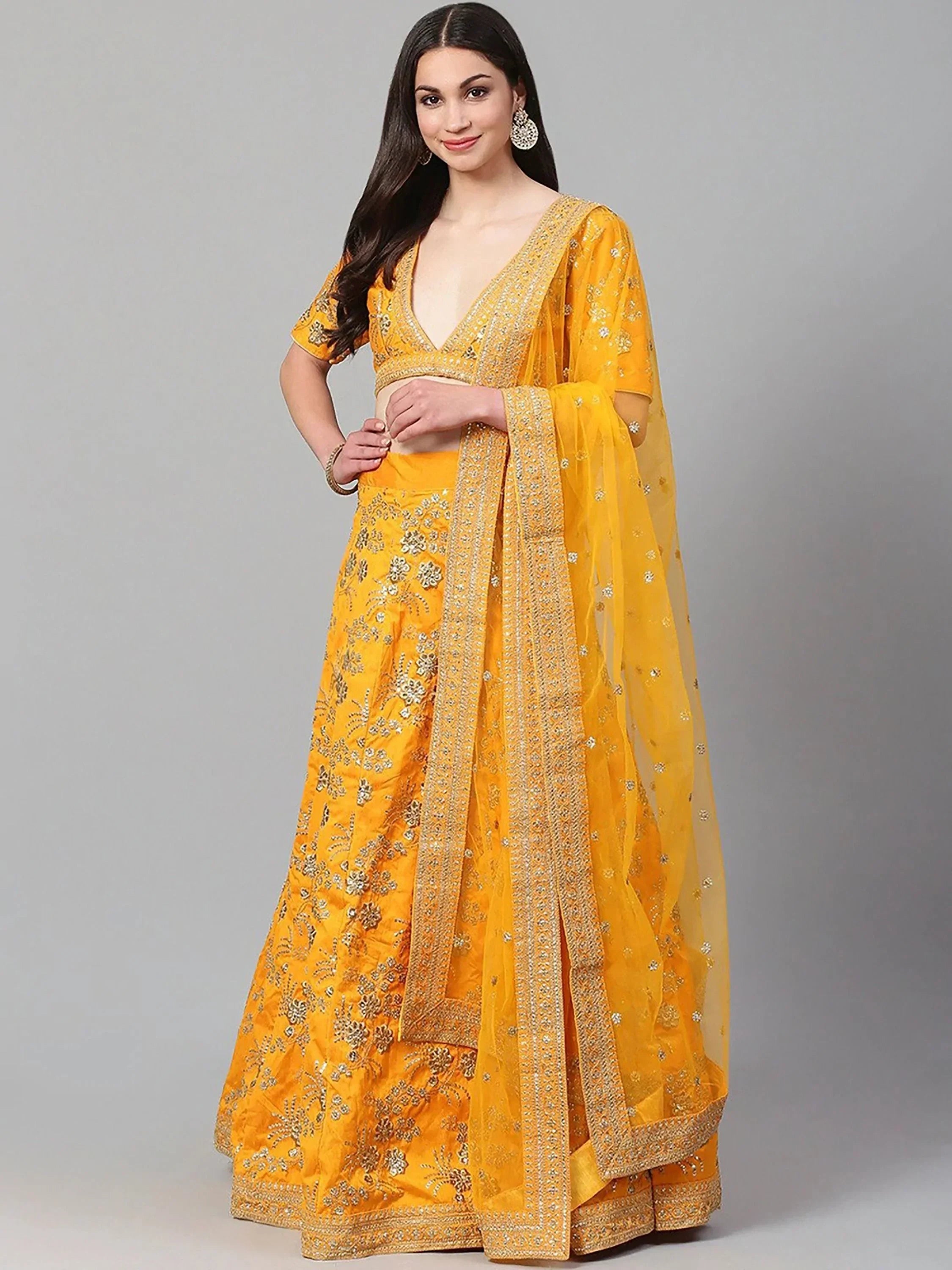 Yellow designer lehenga choli with gold embroidery and sheer dupatta, ethnic Indian wear