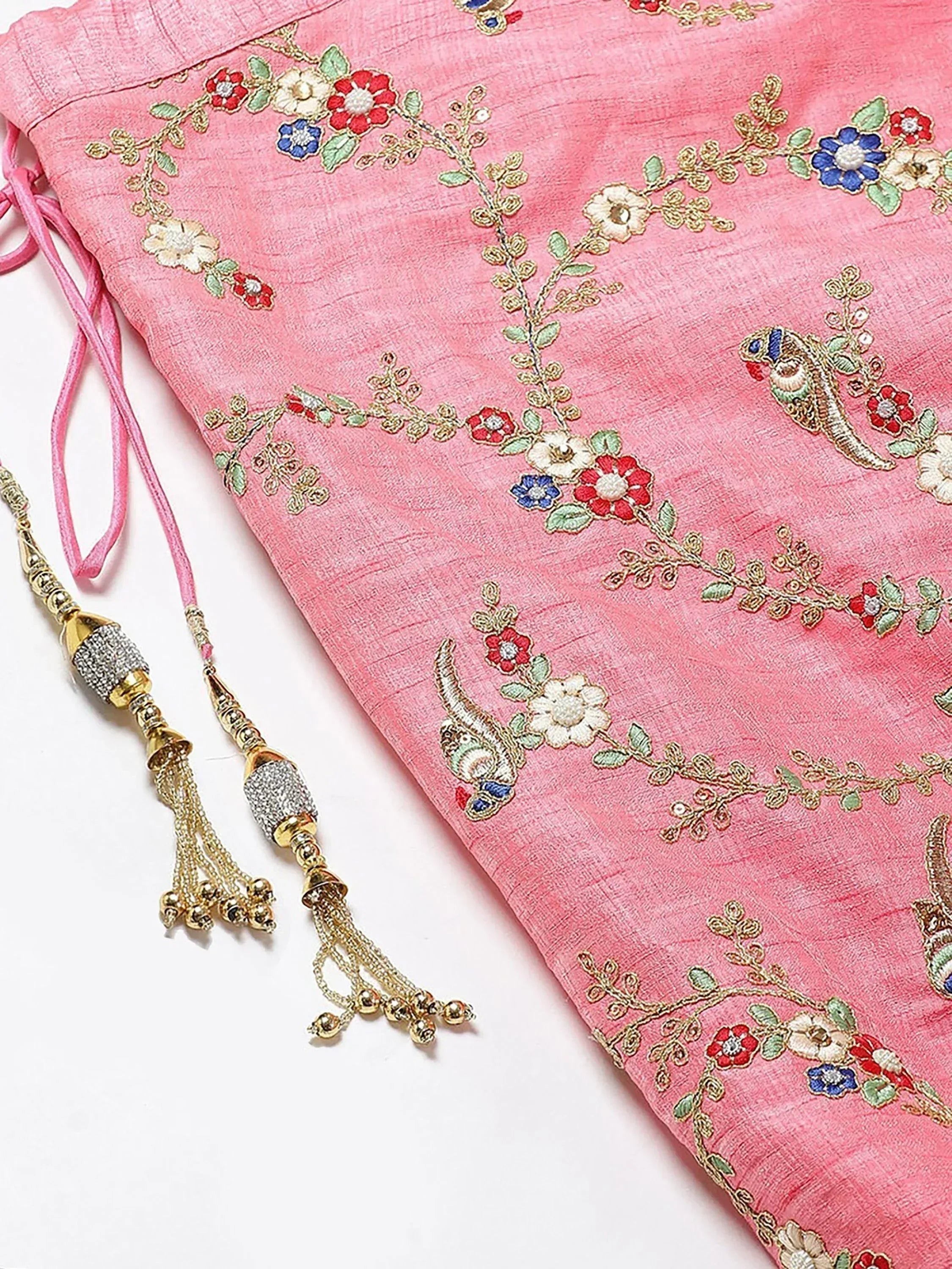 Pink ethnic dress with floral and bird embroidery, gold tassels, perfect for Indian occasions