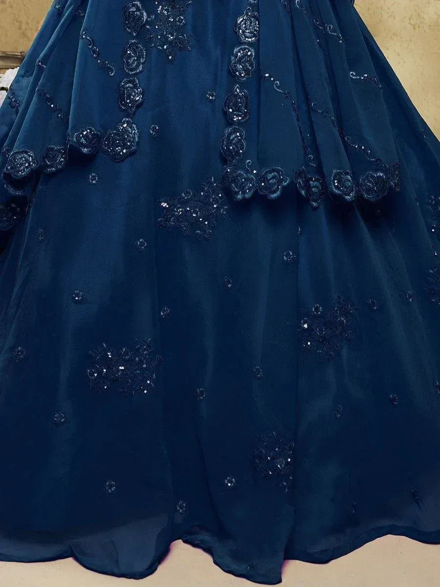 Navy blue ethnic gown with floral sequin embroidery, perfect for Indian weddings and festive occasions.