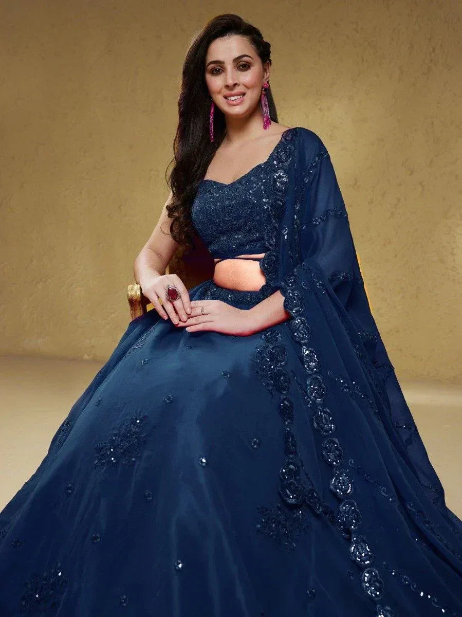 Navy blue designer lehenga choli with floral embroidery and sequins, perfect for Indian ethnic occasions