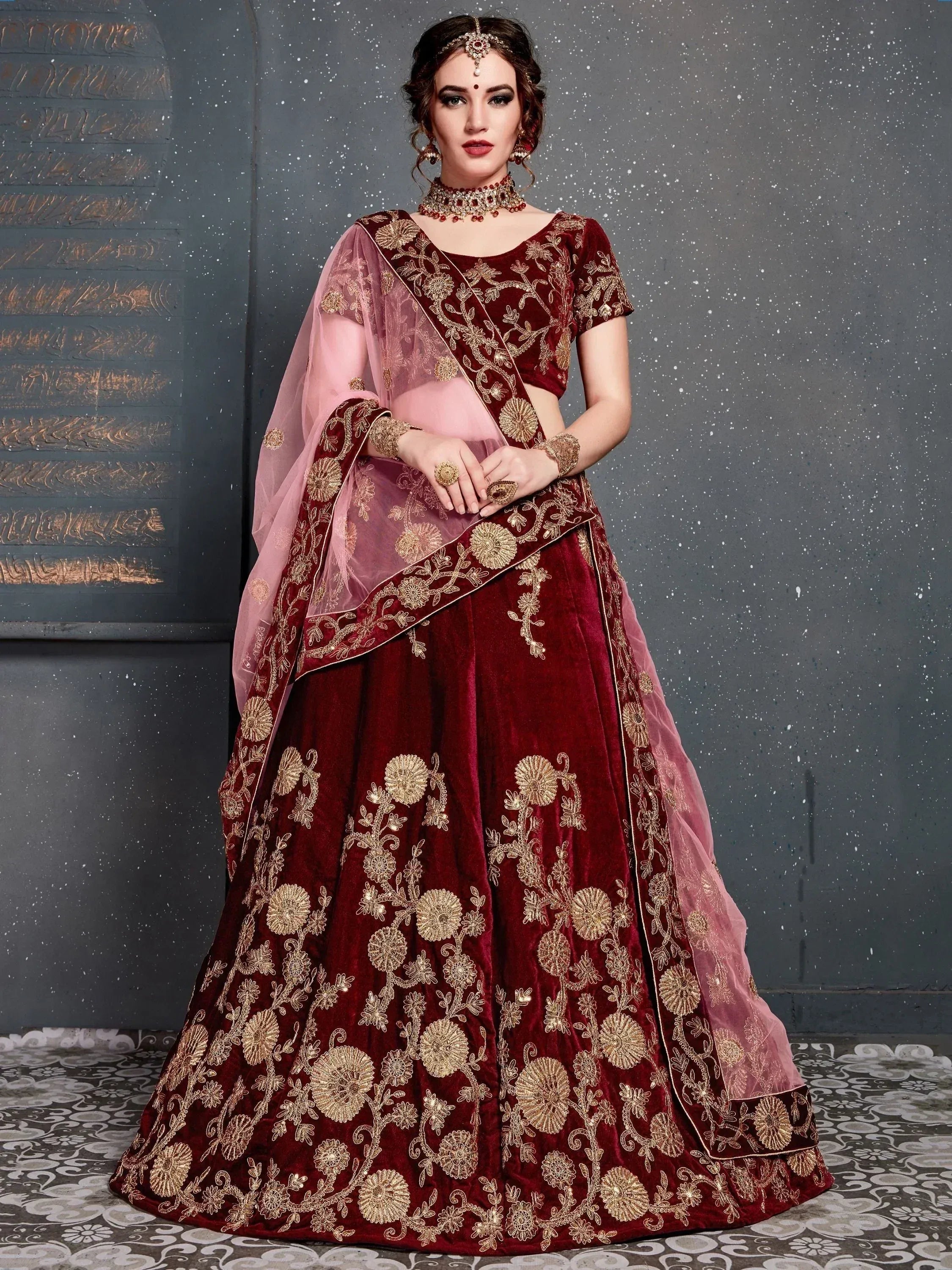 Maroon velvet lehenga choli with gold floral embroidery and pink dupatta, Indian ethnic wear
