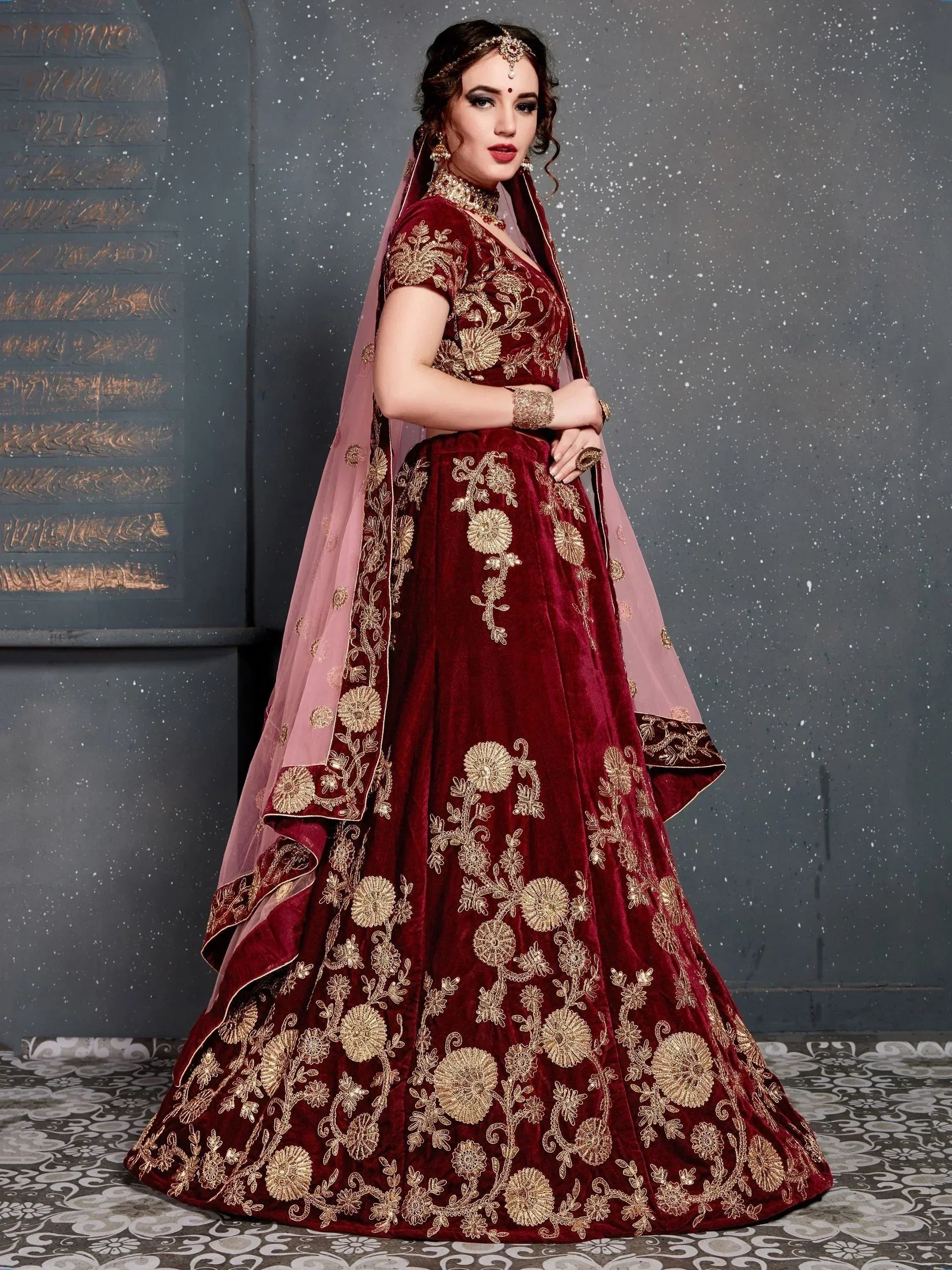Maroon velvet lehenga choli with gold floral embroidery and pink dupatta, Indian ethnic wear