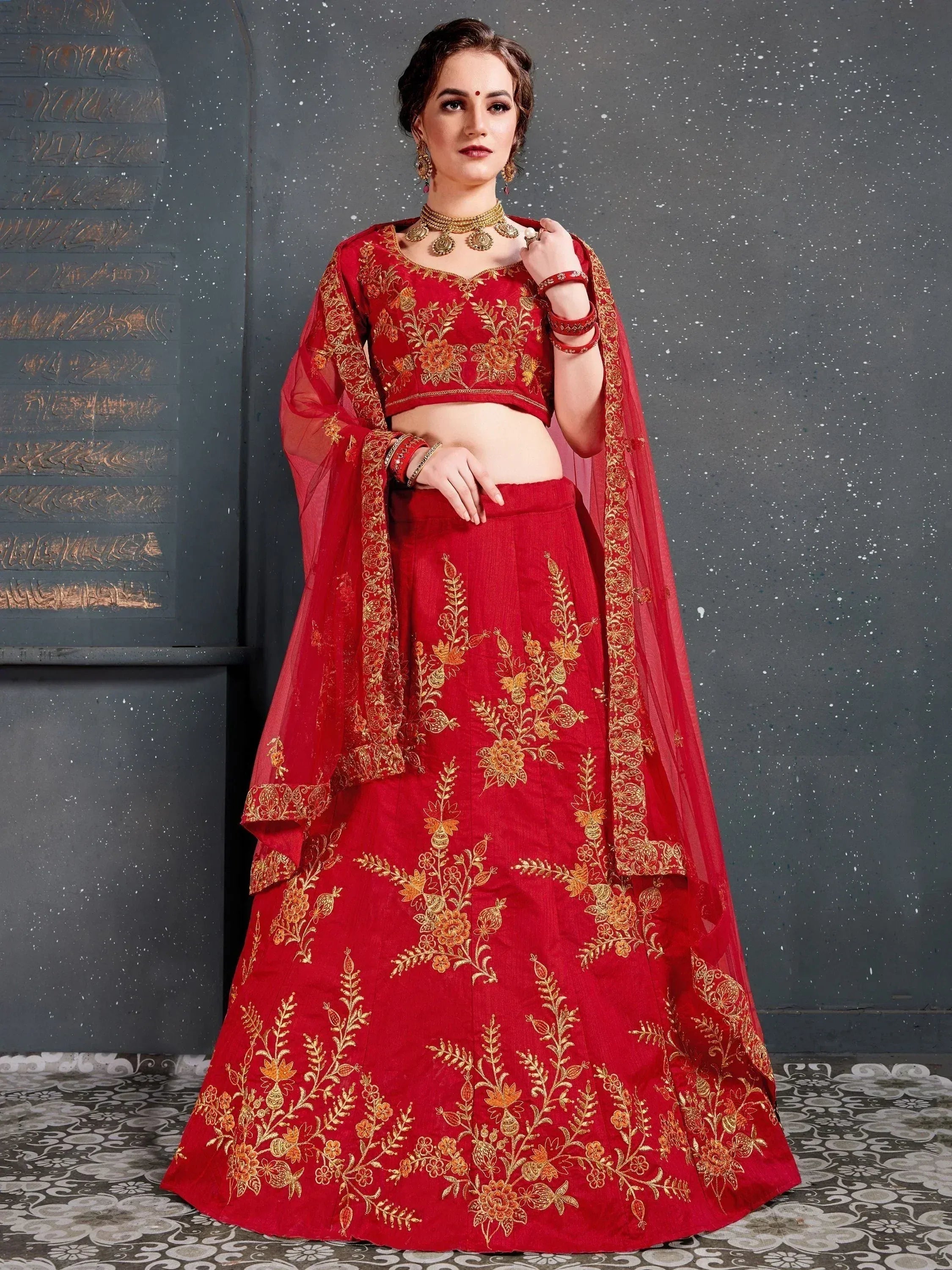 Red embroidered lehenga choli with gold floral work, perfect for Indian ethnic wear occasions