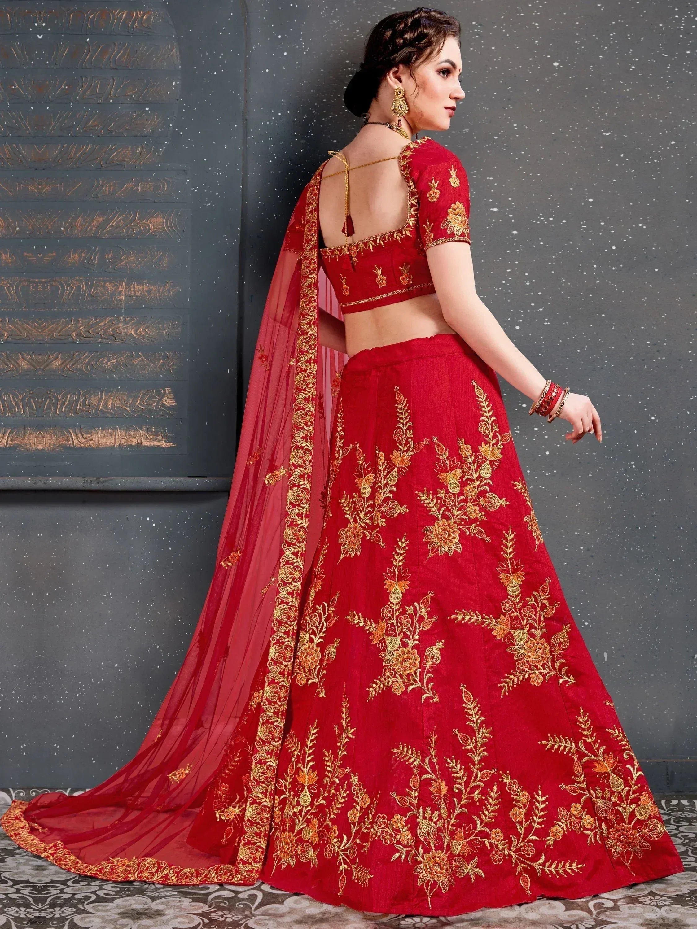 Red lehenga choli with gold floral embroidery, backless blouse, and matching dupatta for Indian ethnic wear