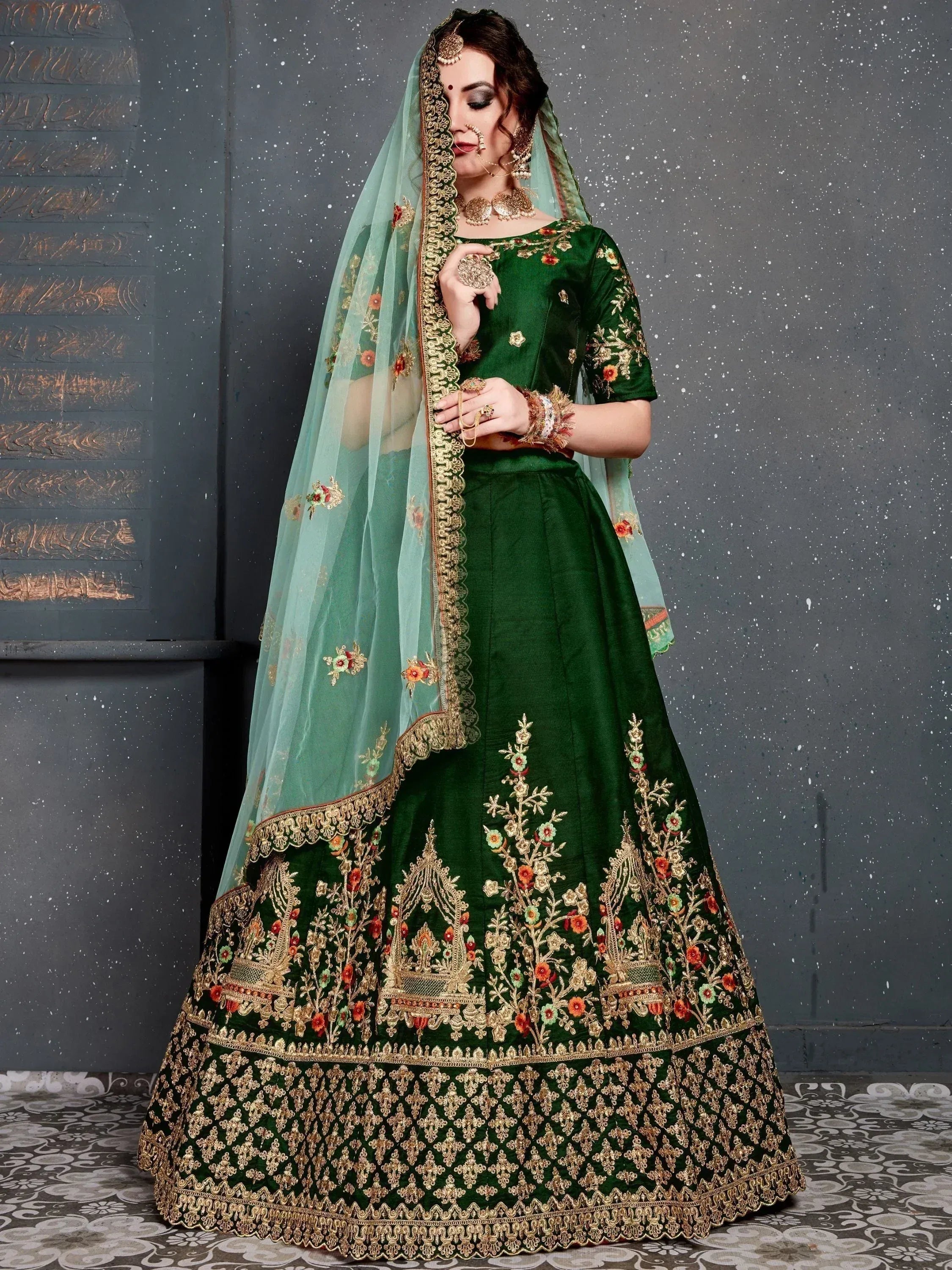 Emerald green designer lehenga choli with gold floral embroidery and sheer dupatta for Indian weddings