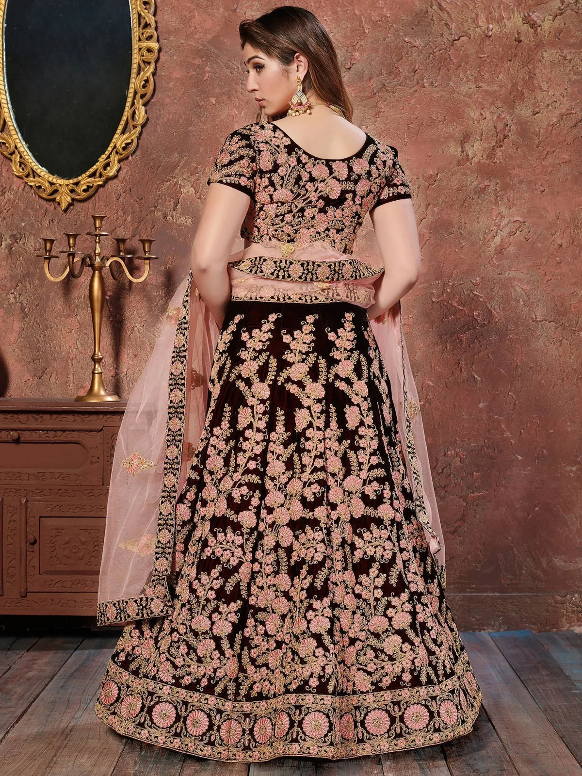 Elegant black lehenga with pink floral embroidery and matching dupatta for Indian ethnic wear