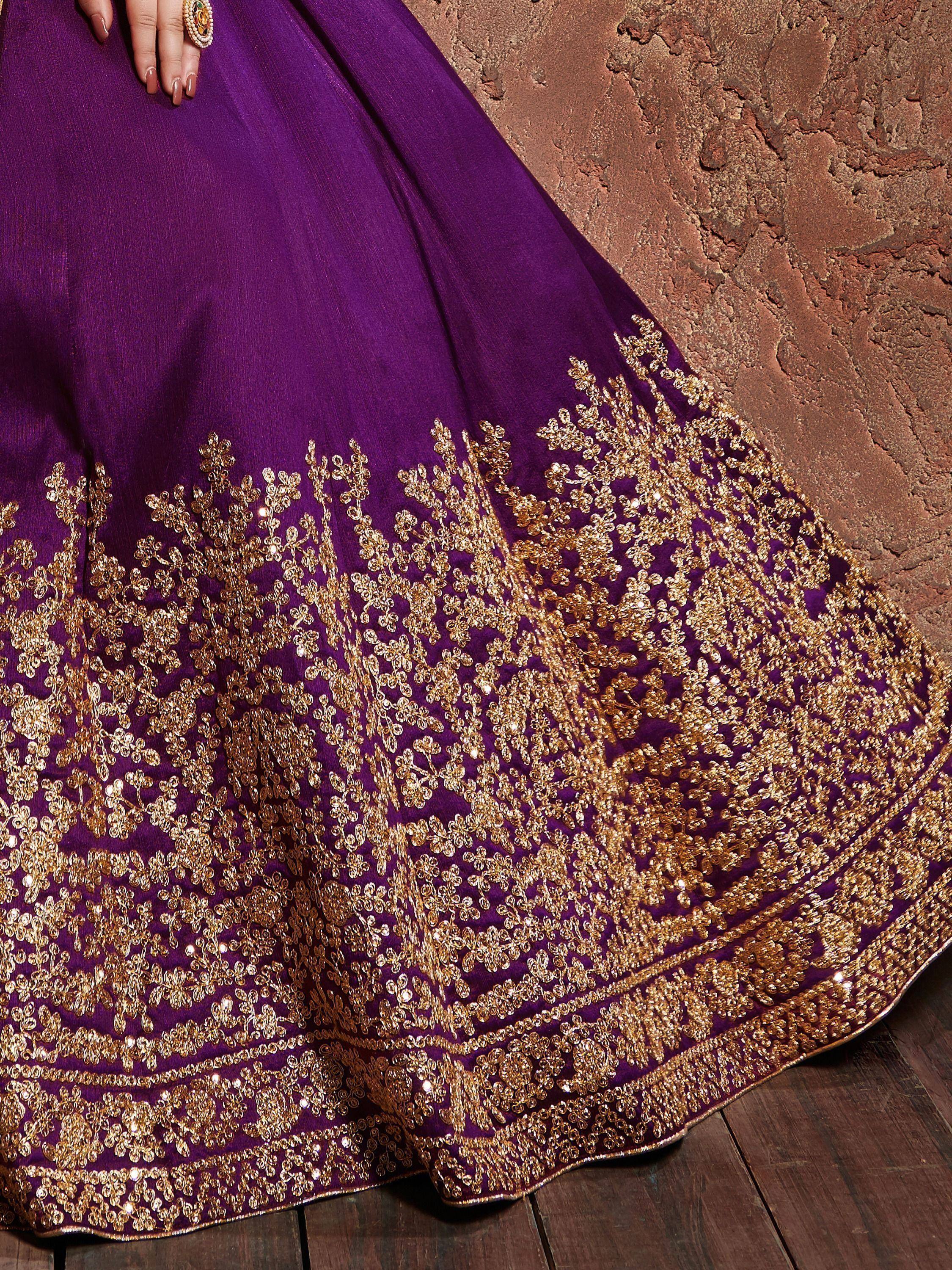 Purple lehenga with intricate gold embroidery and sequins, perfect for Indian ethnic wear occasions.