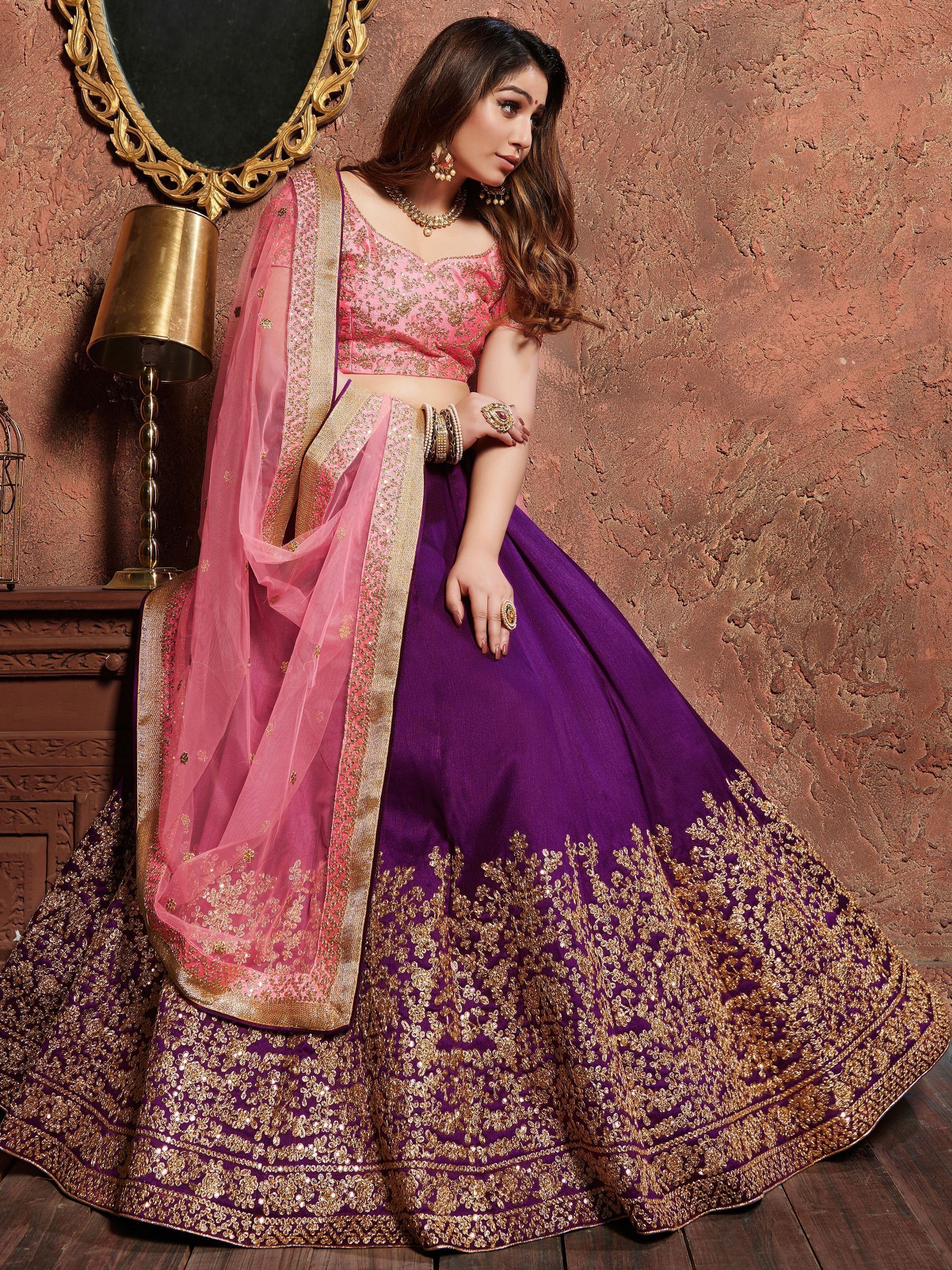 Purple and pink designer lehenga choli with gold embroidery, perfect for Indian weddings and festive occasions.