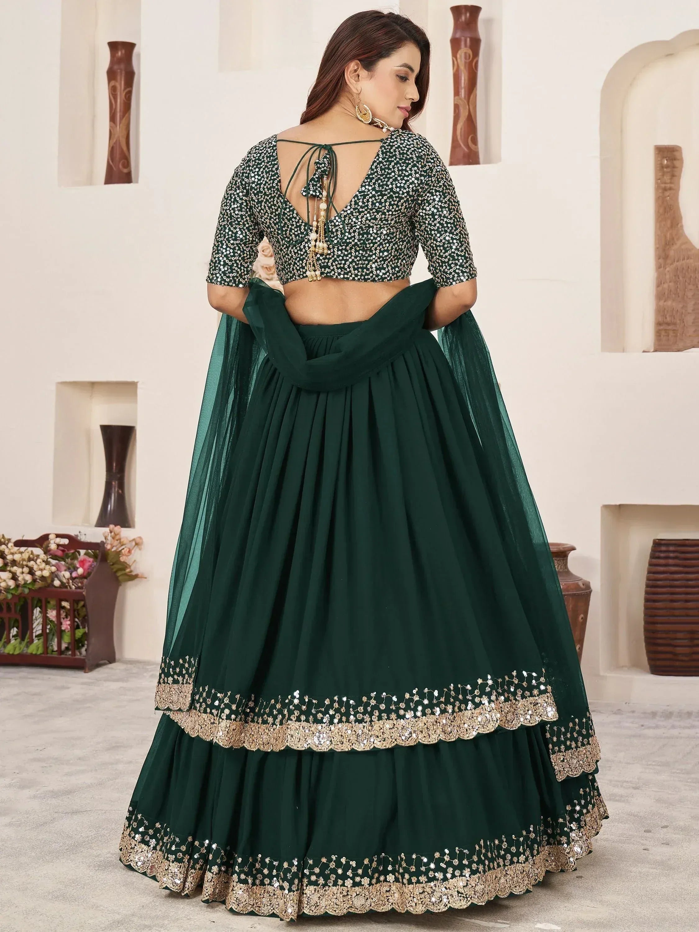 Emerald green sequin lehenga choli with gold embroidery, back view, ethnic Indian wear